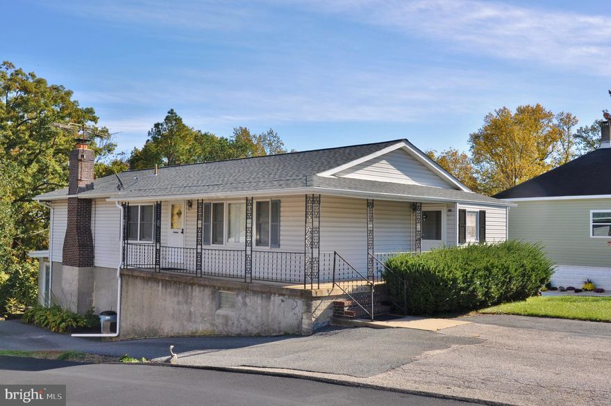 Amazing opportunity in a great neighborhood!  Currently set up as two living quarters, top and bottom.  Main level is dated but very nice.  Lower-level needs rehab.  Live in one while fixing the other.  Make into one large house or keep it as two separate living spaces.  The house sits on a big lot that backs to trees.  Awesome opportunity for investors.

Lovely, covered wrap around porch.   Convenient double wide driveway for parking two cars out front and then continues around the back.  Central Air conditioning and nice replacement windows.  New roof in 2018. 

Main level has living room, dining room, eat in kitchen, three good size bedrooms, mud room with laundry, one full bath and a half bath.   Under all the carpet on the main level are lovely wood floors.  

Lower level is currently set up as a completely separate living space.  Livingroom with brick fireplace, dining area, full kitchen complete with all appliances including dishwasher, oven, and double sink.  Potential for three bedrooms,  full bath in the hall, laundry, storage room, plus a sunroom.

Check out all the pictures and call to set up a private showing.  Selling AS IS.  Seller will make no repairs.  Great location with lots of amenities nearby.  All appliances convey with property and a home warranty too.