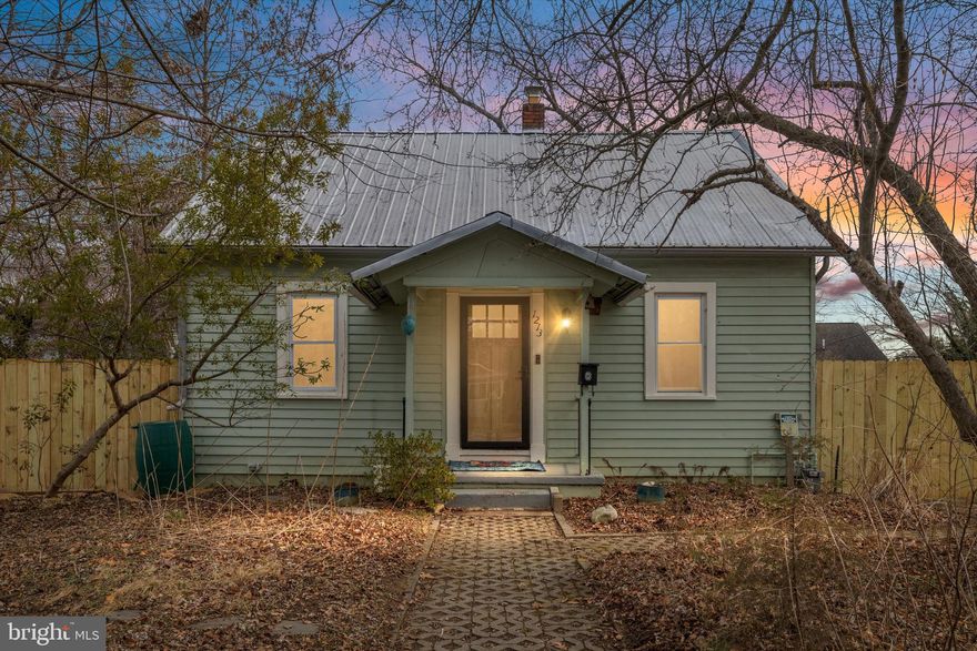 Presenting a charming, thoughtfully renovated Cape Cod in the Colony Hills section of Eastport. This unique property boasts eco-sensitive, no mow / low maintenance grounds filled with native plants, earning Bay Wise, NWF Wildlife Habitat, and Home Grown National Parks certifications. 
An equally amazing interior - gracious, light- filled spaces augment period trim and locally reclaimed interior panel doors. Modern kitchen with very recent LG ThinQ steel appliance suite including WiFi enabled stove, dishwasher with hidden controls. Welcoming front porch, energy efficient (and gorgeous!) metal roof, coveted driveway parking. Two main level bedrooms, with a third upstairs - all a generous size. Fully renovated bathroom with heated floors. Freshly painted interiors. Hardwood floors throughout most of the home. Ample upper level storage - currently configured as a walk- in closet; could function as a home office or playroom also. Main level laundry room / flex space leads to patio area and fenced back yard.


Aesthetically pleasing, highly functional shed features glass doors, living roof, rainwater collection point. Side exterior access to the basement - systems and additional storage. Tankless gas hot water heater.  Additional open parking on one- way street. Quietly tucked away, yard features over 150 different native and pollinator friendly plants, a rain garden, and raised vegetable bed - nature abounds! Yard is stunning in season, see photos. Quick access to all of Eastport, DTA, Truxtun Park, Pip Moyer Rec Center. Ample dining, shopping, lifestyle options - Diehl’s, Eastport Kitchen, Vin 909, Davis’, Lewnes, Boatyard…This is your Eastport. You live here.


*Proceed with caution given weather conditions. Driveway, front walk have been professionally cleared but icy spots may result as melting areas refreeze with temperature shifts. Access to shed and basement at your own risk; the snow is iced over and exceedingly slick. * 


Sunday's previously scheduled open house canceled due to weather forecast. Thanks for your understanding.