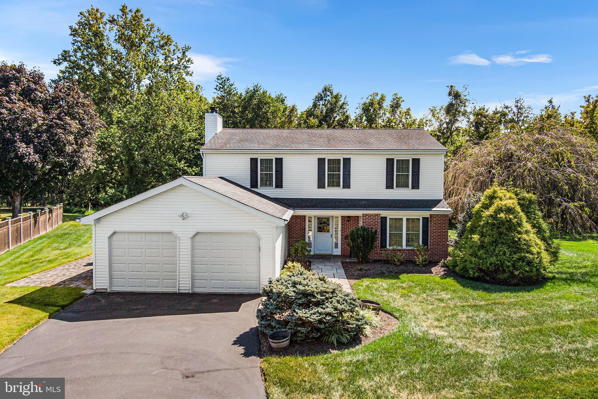 Meticulously Maintained Colonial in Newtown Crossing Offered for the first time by the Original Owner and ready for your personal touches! This lovingly cared-for and move-in-ready home checks all the boxes with thoughtful upgrades, top-of-the-line systems, and a PRIME SETTING in one of Newtown’s most desirable neighborhoods. Nestled on a private cul-de-sac lot backing to wooded common land, the property enjoys a serene natural backdrop, open space, and direct access to trails along the beautiful Neshaminy Creek—perfect for hiking, fishing, or simply enjoying nature. Inside, you’ll find a warm and inviting layout, and you'll be greeted by a chic neutral paint scheme throughout the main level (just done within last 10 years). Newer carpet in family room as well as on stairs and at upstairs landing/hallway will help you feel even more at home. A cozy brick-surround fireplace in the living room, presently decommissioned and used for decorative purposes, could be the ideal setting for a future gas fireplace insert conversion. The entire main level flows seamlessly from room to room and offers formal living and dining areas as well as a well-maintained eat-in kitchen, a large family room, convenient laundry and a half bath perfect for entertaining. Exit through the rear Pella glass sliding door to your large private rear yard that is the absolute Premium highlight of this incredible location. Upstairs, four spacious bedrooms and two full baths, including a sun-filled Primary Suite with walk-in closet, vanity area, and ensuite bath with upgraded tile and tub surround will offer the space you need to wind down in absolute comfort. The oversized two-car garage provides ample storage, while the home’s impeccable condition and mechanical upgrades give peace of mind for years to come. Major Upgrades and Features Include: Roof with GAF HD Architectural Shingles (2016, Munz Construction, full tear-off); All Pella Windows (2016); TRANE HVAC (2020); AO Smith Gas Water Heater (2023); Expanded 200AMP Electric Panel with Portable Generator Hookup; Gutter Guard System (2018); Newer LiftMaster automatic garage door openers; Recently sealed driveway; All toilets updated throughout the home; Exterior siding just professionally power-washed; Professionally landscaped exterior with stone paver walk; Exterior living spaces include a covered front porch, rear brick patio and side paver patio; Large rear shed! Living in Newtown Crossing means enjoying LOW HOA Fees and incredible community amenities such as a large playground, in-ground pool, swim team (at extra cost), newly restored tennis and pickleball courts, and a historic 1700’s stone Manor House for private and community/holiday events. The sense of community you will feel here is unlike anywhere you've ever lived, and with close proximity to Newtown Borough’s shopping, dining, and nightlife, as well as convenience to major commuter routes, this location is second to none. This is the one you’ve been waiting for—schedule your showing today!