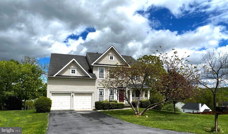 Welcome to this stunning three-level colonial home with a traditional floor plan, situated in a prime location close to major commuter routes and the VA Medical Center. Boasting five bedrooms, three and a half bathrooms, a laundry room, and an office, this home is perfect for  households of any size.

As you enter the home, you are greeted by an elegant two story foyer draped on either side by the  formal dining room and living room which opens onto the front porch. Perfect for hosting guests or enjoying quiet evenings at home and a country sunset or two.  Whether you're curled up with a good book or enjoying a movie with friends an inviting great room with gas fireplace  adds an extra touch of warmth and comfort to this already inviting space. Adjacent is a beautifully designed kitchen, complete with  ample storage, and a center island perfect for meal prep or casual dining.  The breakfast area spills out onto a composite deck overlooking the great backyard, hot tub, and stunning views, This home is an entertainer's dream.

The primary bedroom with it's very own sitting room is located on the upper level, offering a peaceful retreat at the end of the day. The attention to detail in this  en suite is evident throughout, with high-end fixtures and finishes that add to the overall feeling of luxury and comfort. Whether you're starting your day or winding down at night, this bathroom is the perfect place to pamper yourself and rejuvenate your body and mind. And with three additional bedrooms and another bathroom on this level, there is plenty of space for everyone to relax and unwind.

Convenience is key with this home as it's located minutes away from shopping, restaurants and major commuter routes. Not interested in the commute? Make no mistake, the  office  nestled away  behind the kitchen makes working from home a breeze.

In addition to the upper levels of the home, the finished basement also offers its own living space, complete with a bedroom, full bathroom, living room, and office. This versatile space provides the perfect opportunity for multigenerational living, hosting guests, or even renting out as a separate apartment.

With ground-level access to the brick patio and lush backyard, this basement living space seamlessly blends indoor and outdoor living, providing a peaceful oasis to enjoy the beautiful views and warm weather. The brick patio provides the perfect setting for outdoor entertaining, with plenty of space for a grill, patio furniture, and even a fire pit for cooler evenings. And with a hot tub located just steps away, this backyard is the ultimate retreat for relaxation and rejuvenation.

This three-level colonial home truly has it all, from the spacious living areas and beautiful views to the  location and versatile living spaces. Don't miss your chance to make this stunning property your own!