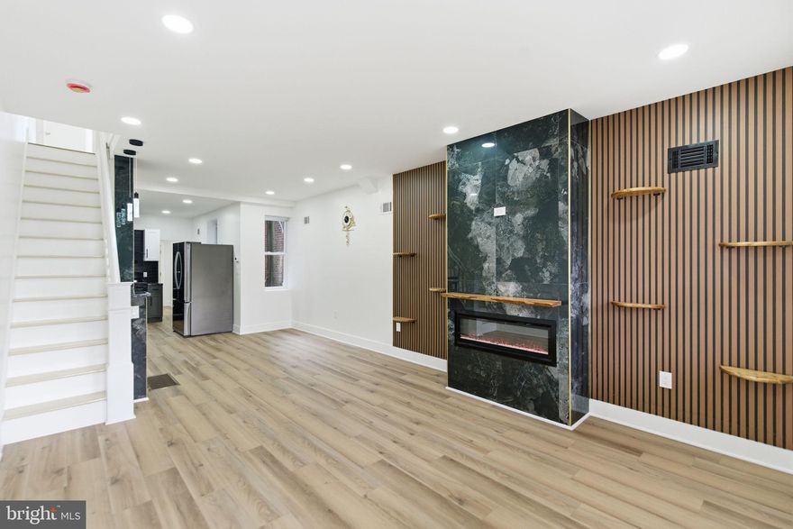 Come by for an open house Saturday 1/31 from 10-12!
Come see this beautifully renovated home located on a friendly Bridesburg neighborhood. The neighborhood has undergone extensive transformation, including the the renovation of the old historic Chocolate Factory, which is now turned into a modern building, hosting the nonprofit, Concilio. The best part? There are still renovations happening on the block as of this posting.  

Once you enter your new home, you can't help but notice the media wall to your right. Equipped with a fireplace that's complimented with acoustic paneling to warm you, your family, and your guests. Transition over to the ultra modern kitchen and you'll see that this kitchen is fully equipped with everything Chef needs and wants (see pot filler). 
On the 2nd floor, you have 3 bedrooms and 2 full baths. After you wake from your primary bedroom, just slide that barndoor over and try not to stare at that good lookin' person for too long. Instead you can admire your luxurious primary bath that features a floating vanity, golden finishes, beautiful tile work, and of course...that LED mirror ;)
Bonus? The basement is fully finished and has a half bath. Behind the kitchen is your w/d hookup and another half bath. There's also a large backyard with more than enough space to make into your own backyard oasis.