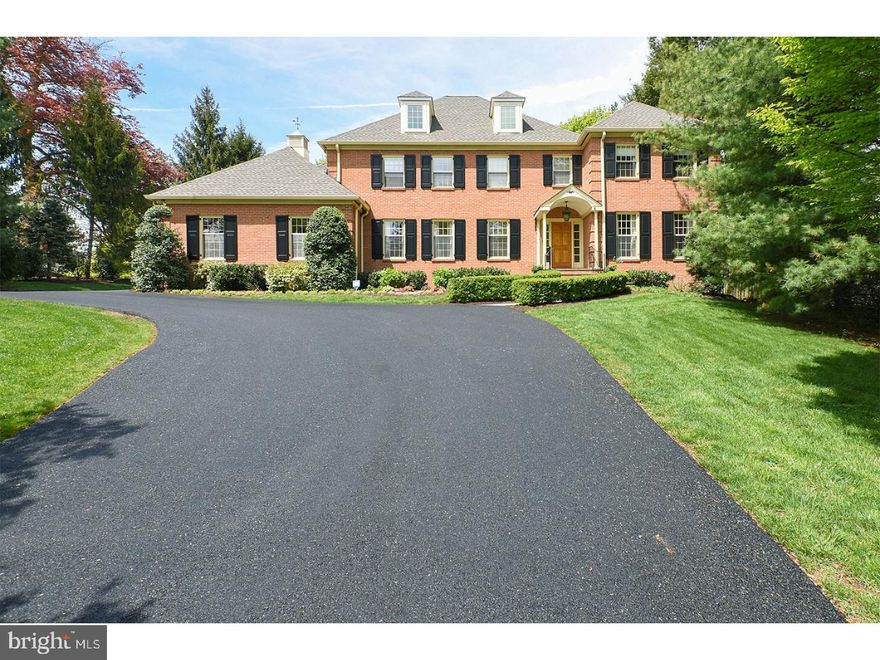 This meticulously maintained, custom built, brick Colonial has curb appeal! Gracious open floor plan interior and beautifully designed! This is a desirable area, with access to all major highways and King of Prussia Mall. Close to Suburban Square, Center City, and Philadelphia Country . Pristine landscaping with specimen plantings, tall trees flat lawn in the back with room for pool. This immaculate home is superb for entertaining, with spacious, light-filled rooms that flow onto the extensive patios. The elegant, two story-foyer with curved staircase leads into a large living room centered by a wood-burning fireplace adorned with custom window treatments. Built-in speakers fill the ambiance with music.   Glass French doors lead out to the splendid flagstone patios great for AL Fresco dining. The large dining room off of the kitchen offers a sophisticated setting for entertaining. The chef's kitchen boast a functional layout, highlighted by custom cabinetry, stainless steel appliances, new sub-zero refrigerator, a wet bar with ice machine, breakfast room and generously sized granite-top island with storage and seating for all to gather around. Comfort on the first floor continues with a large Rec room off the kitchen and Sunroom with skylights. The curved staircase leads to second floor master suite with walk-in closet. Three additional bedrooms with closets along with a full bath, a laundry room and an additional attic storage space, compliment the second floor. The third floor  has a 5th bedroom and separate AC/Heat zone makes perfect au-pair suite with full bath and cedar closet. Use as a gym   or just relax in the finished basement. This house has 3 zone heat/AC . A security system provides protection and peace of mind.