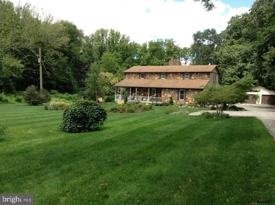 Secluded 2-story home on 9 acres.  Home boasts wood flrs, country KIT w/ granite, stone FP, formal LR & DR.  Central vac, zoned heat, whole-house fan, huge upstairs BRS w/ WIC, finished BSMT w/ wet bar & walk-out.  2-car heated GAR.  Land has stocked pond, bank barn, stream, separate GAR/workshop, shed, gardens, trees & wildlife.  Still close to everything.