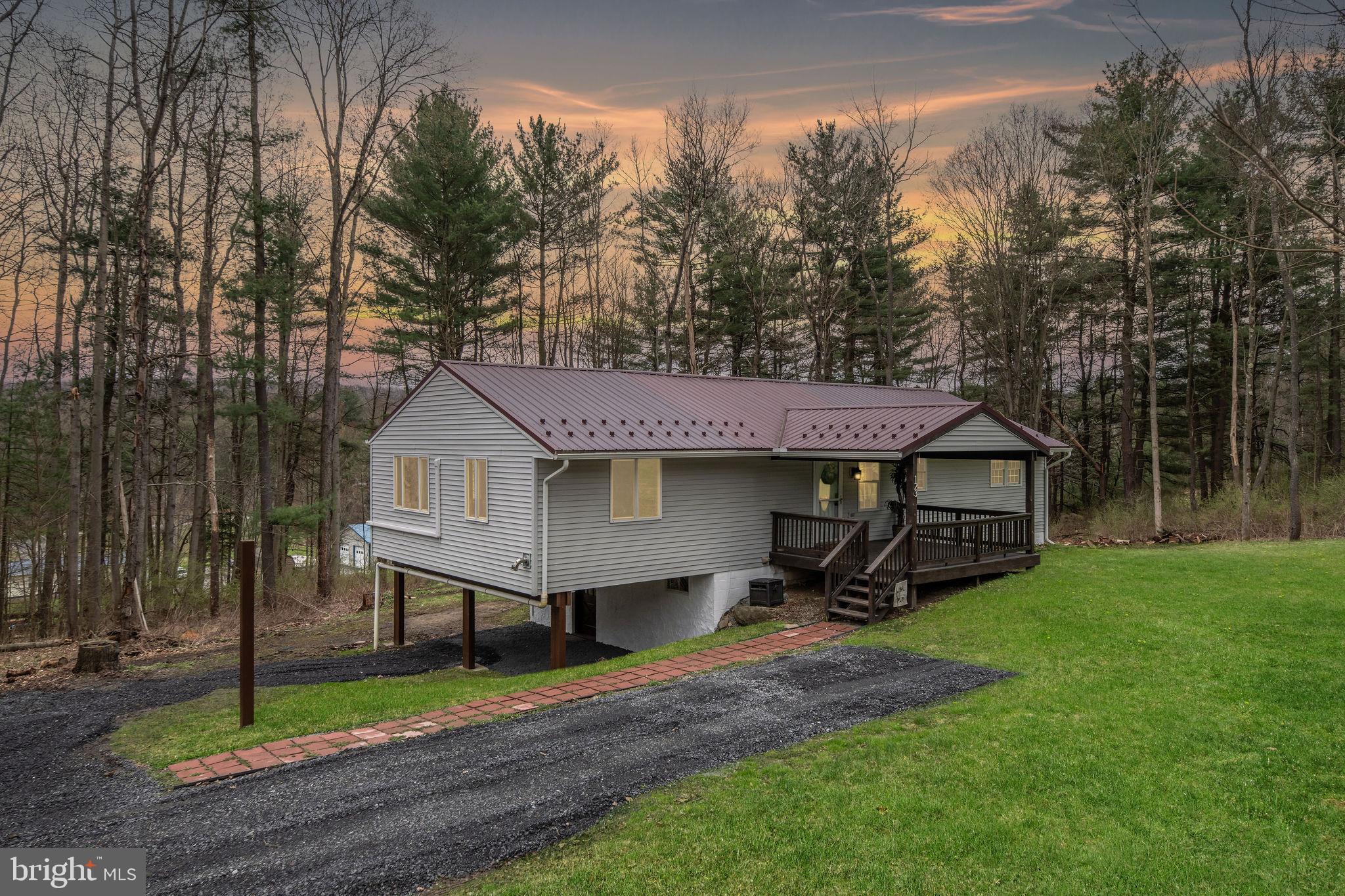 Have you been looking for a cozy dream home in a peaceful setting? Look no further than 123 Riggs Lane! This charming 4-bedroom, 2-bathroom home sits on a full acre of land, offering plenty of space for outdoor enjoyment. Inside, you'll find beautiful updates throughout, blending modern touches with warmth and comfort. The huge kitchen is a real highlight, featuring tons of storage and ample counter space, perfect for cooking and entertaining. The open concept design flows seamlessly into the dining area, creating an inviting space for family and friends.
The grand living space, with its vaulted ceilings, adds to the home's airy and spacious feel, making it the perfect place to relax and unwind. Step outside to the large covered deck, ideal for enjoying the fresh air or hosting outdoor gatherings. The large yard provides plenty of room to play or simply enjoy the peaceful surroundings.
This home offers the perfect balance of comfort, style, and tranquility—schedule a tour today to see all it has to offer!