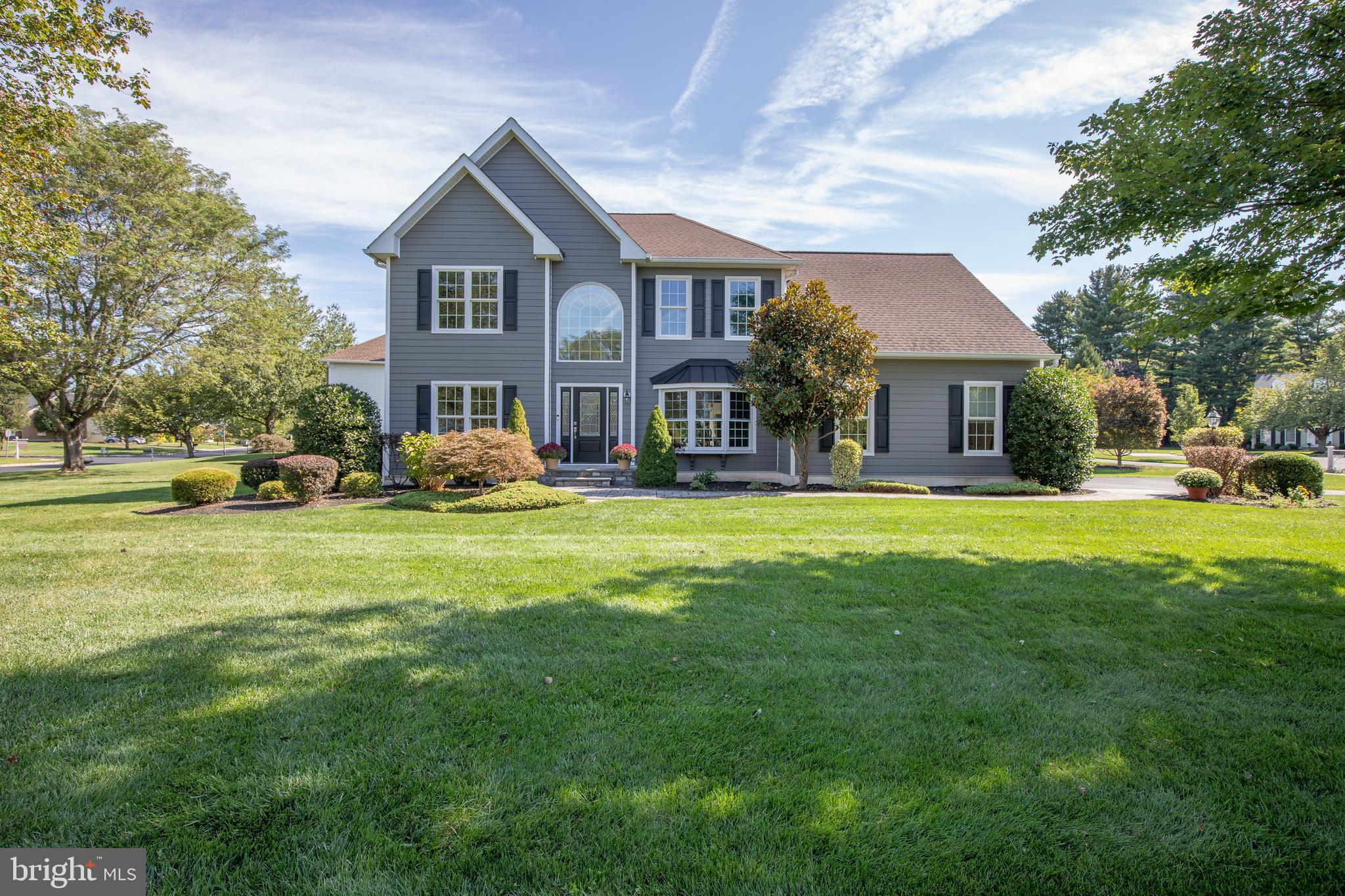 Welcome to Cold Spring Hunt, one of Buckingham Township’s most beloved neighborhoods, where this Toll Brothers home pairs timeless design with an unbeatable location! Tucked away on a private cul-de-sac street, the setting immediately feels warm, welcoming, and serene. Step inside to a soaring 2-story foyer where recently refinished hardwood floors - laid on the diagonal - flow across both sides of the center staircase into the living room and dining room. Grand 9’ ceilings stretch throughout the main level, and the floorplan is perfect for both relaxed everyday living and memorable gatherings. The kitchen features rich cherry cabinetry, sleek quartz countertops, an angled tiered island with breakfast bar, and a sun-lit breakfast room framed by walls of windows and sliding glass doors. Open to the family room where a cozy gas fireplace and fresh carpeting invite lounging and connection. Upstairs, the primary bedroom suite is a peaceful retreat featuring a trey ceiling, spacious walk-in closet, and a tiled bathroom with cherry vanities. Three additional bedrooms share a well-appointed hall bath with double sinks. The finished lower level adds even more versatility with room for a home office, game room, plus plenty of unfinished space for storage. Practical upgrades—including durable Hardie Board siding, windows, HVAC units and economical 2-zoned temperature control, hot water tanks—offer peace of mind. Enjoy the privacy of mature landscaping in the backyard, the convenience of an oversized garage with inside access, and the everyday ease of a main-level laundry room. Walk or bike to Cold Spring Elementary, Hansell Park, and George M. Bush Park along the scenic Bike & Hike trail. Just minutes from historic Doylestown’s shops, dining, and cultural events, and with easy access to Philadelphia, New Jersey, and New York, this home truly delivers the best of Bucks County living! Make your appointment today!