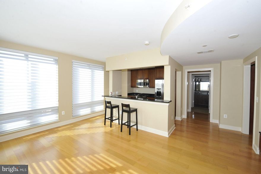 Stunningly beautiful large luxury home in a boutique condo above the Westin Hotel. Enjoy wood floors, gourmet kitchen (granite, SS appliances, dual sink, breakfast bar), large windows for lots of light, professional closet systems, wall mounted flat screen tvs & more. Gym, room service & Maid Service offered for a fee. Walk to Metro, shops, restaurants, etc 2 garage/1 storage space included