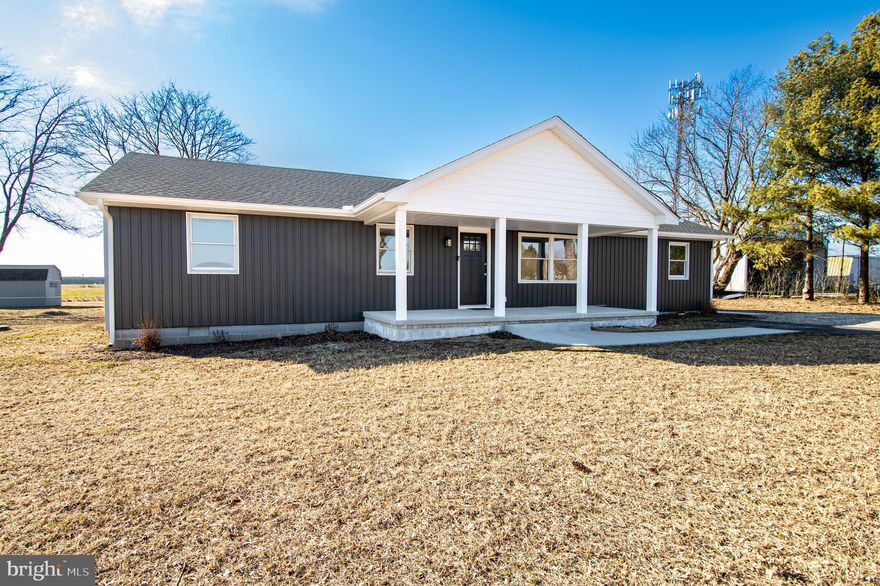 Fully remodeled and move-in ready! This beautifully updated 3 bedroom, 2 bathroom home in Laurel, DE sits on a spacious .95-acre lot, offering the perfect blend of modern upgrades and peaceful country living. Walking through the front door, you’re welcomed into a bright living room that flows seamlessly into the open kitchen and dining area, creating an ideal layout for everyday living and entertaining. The kitchen has been completely updated and features new cabinetry, granite countertops, stainless steel appliances, and a center island for additional seating and prep space. Just off the kitchen is a second living area with a sliding glass door leading to the back deck — perfect for relaxing or hosting guests. A large utility room adds extra functionality and storage space. Extensive renovations include new LVP flooring, LED light fixtures, new plumbing, insulation, roof, porch, concrete walkways, back deck, doors, and fresh paint throughout, giving the home a modern, turnkey feel. A new gravity septic system has also been installed for added peace of mind. Conveniently located just minutes from Trap Pond State Park, this property offers easy access to outdoor recreation while still being close to town amenities.