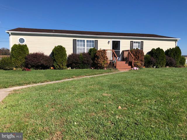 Very clean and well maintained double-wide in Strawberry Village. It is on a large lot at the end of the cul-de-sac. In 2011 a new roof was installed, the back deck was converted to a screened porch and a full kitchen update. The master bedroom has a vaulted ceiling, two closets and a master bath with a soaking tub. There is a separate office area and laundry room. A concrete driveway and shed complete the outside.