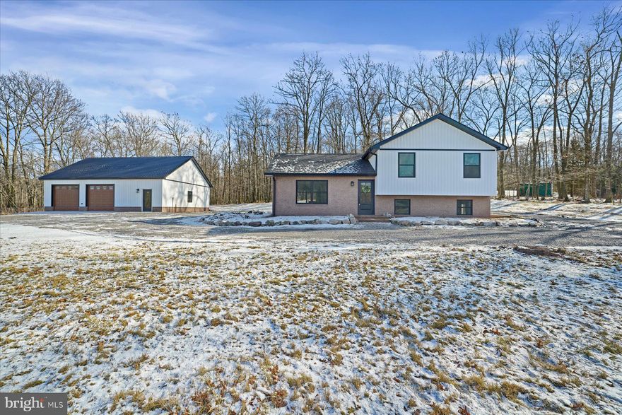 Completely remodeled and move-in ready, this beautiful home sits on 1.44 acres offering a peaceful setting with easy access to both Altoona and State College. The interior has been thoughtfully updated throughout with modern finishes and a bright, inviting layout designed for everyday living and entertaining. The spacious primary bedroom features sliding doors that lead directly to the back deck and includes a private full bathroom. Two additional bedrooms and a second full bath provide flexibility for guests or additional living space. The walk-out lower level features a bonus room that can serve as a fourth bedroom or an ideal office, along with a family room and laundry room. Outside, enjoy the privacy and open space of the property along with a 30x40 detached garage building that offers excellent storage, workshop potential, or room for recreational vehicles. A rare opportunity to enjoy a completely renovated home with acreage while remaining conveniently located.