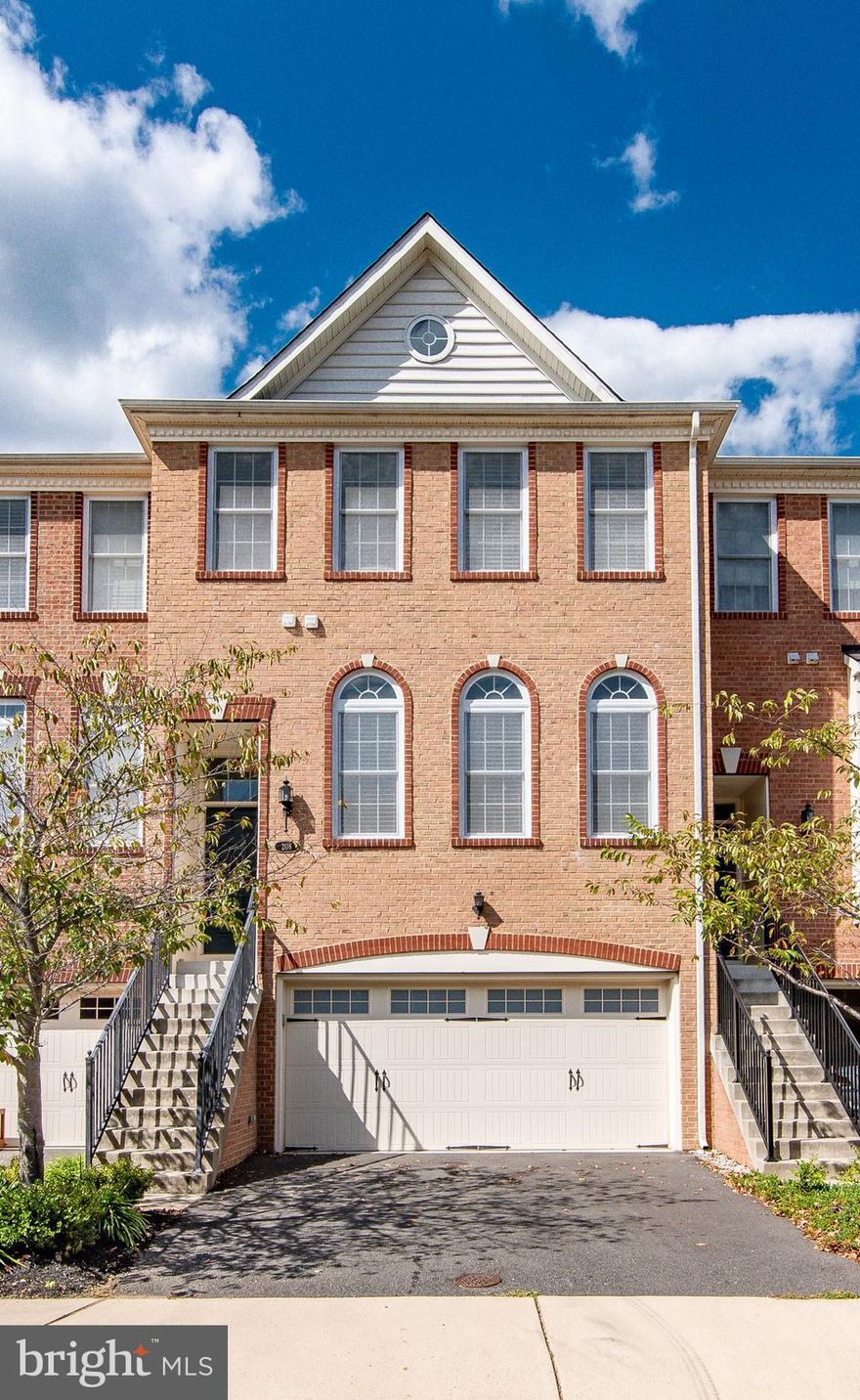 Gorgeous three level brick front townhome, with 2 car garage located in the sought after community Purcellville Green. Very nicely appointed throughout. Open layout with large living and dining room.  Eat in kitchen with breakfast area and breakfast bar.  Kitchen has updated stainless-steel appliances, beautiful backsplash and granite counter tops. Sliding glass door off of kitchen leading out to a huge deck, fantastic for BBQing and entertaining.  Upstairs has a large primary suite with walk-in closet and an en-suite bath with dual vanity, soaking tub & separate shower.  Two additional nice sized bedrooms with hardwood floors.  Upper-level laundry. Lower-level rec room with full bathroom.  Fenced in rear yard.  Purcellville offers many amenities to residents.  Located very close to commuter routes, as well as downtown Purcellville, with plenty of restaurants, shops and the WO&D trail.