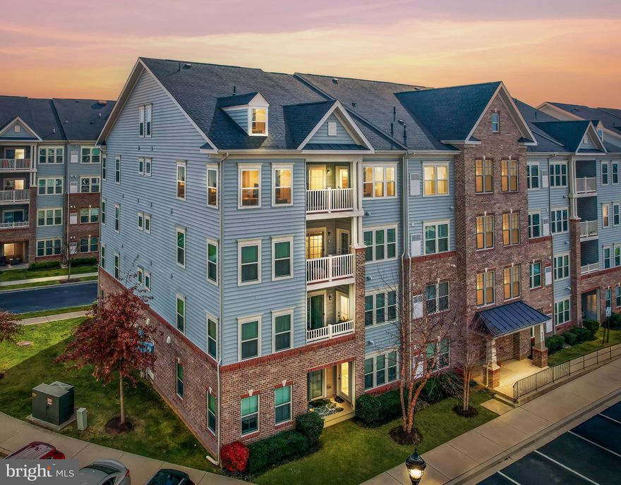 This stylish 2-bedroom condo in Frederick is listed at $415,000 and offers an impressive 2,077 square feet of bright, open living. Perched on the top floor, it features vaulted ceilings, beautiful hardwood floors, and an airy loft that overlooks the main living area—perfect for a home office, guest retreat, or creative studio.

The kitchen delivers both style and function with granite countertops, a custom tile backsplash, stainless steel gas range, a French-door refrigerator, recessed lighting, and a deep stainless-steel sink. The large peninsula adds extra workspace, bar seating, and convenient under-cabinet outlets—ideal for cooking, entertaining, or everyday living.

The open-concept living and dining area is filled with natural light thanks to full-size windows and is centered around a cozy fireplace and a modern ceiling fan. The primary suite offers a private full bath with a beautifully tiled shower, while the second bedroom connects to a full hallway bath featuring a tiled tub surround and matching granite—perfect for guests or shared living.

Step outside to your covered balcony with composite decking, dual access, and peaceful views of landscaped walkways. Reserved parking is included.

And the location? Even better. You’re perfectly situated for an easy commute to Washington, D.C., and just minutes from some of Frederick’s best outdoor escapes like Baker Park and Ballenger Creek Park—great for hiking, picnics, sports, and weekend relaxation. For shopping, dining, and everyday essentials, the Francis Scott Key Mall on Buckeystown Pike is right around the corner.