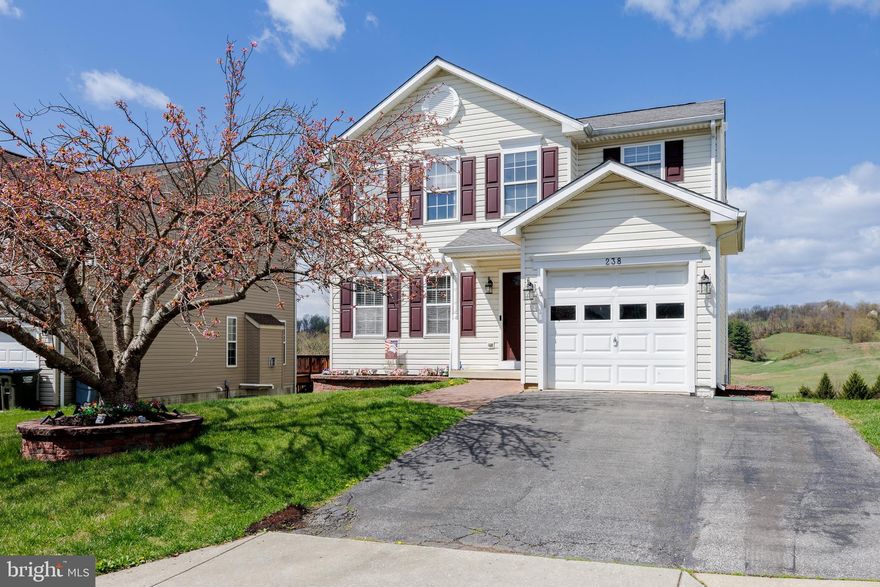 This inviting Colonial welcomes you with a charming covered porch and an attractive front door that makes a great first impression. On the main level, beautiful flooring pairs with thoughtfully detailed molding for a refined yet comfortable feel. The foyer offers custom built-in cabinetry with bench seating—perfect for storing coats, shoes, and everyday essentials. Entertain or unwind in the formal living and dining room, eat-in kitchen features recessed lighting, gas cooking, and a pantry. The kitchen opens seamlessly to a sun-filled family room with a sliding door leading to the deck, ideal for indoor & outdoor living. A conveniently located powder room and direct garage access complete this level. Upstairs boasts a spacious primary bedroom with ceiling fan, an oversized walk in closet, and private bath, along with two additional bedrooms, a full hall bath, and laundry room that offers significant convenience. The finished walk out lower level is perfect for entertaining, providing space for movie nights, games, and casual lounging, along with a wet bar and half bath with shower rough in. The backyard backs to community open space with the community playground, and pavilion right pass your backyard. The scenic countryside views showcase an ideal setting to relax and enjoy the surroundings. WELCOME HOME!!
Some updates include: Fresh Paint, LVP flooring on main level & upstairs hall bath & freshly stained deck.