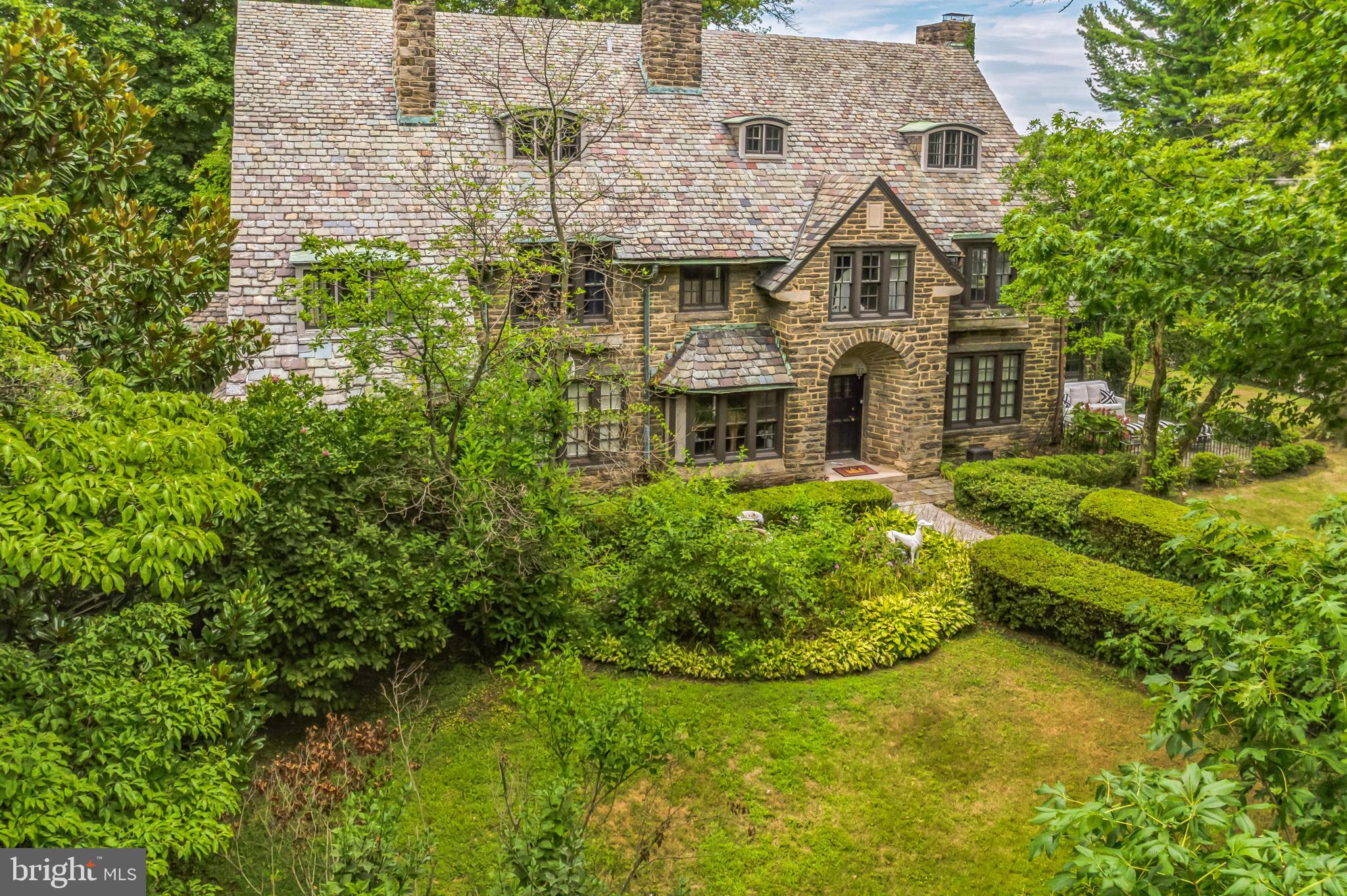 Indulge in the timeless elegance of this extraordinary stone manor at 7005 Clearview St. in Philadelphia. Nestled in the desirable Sedgwick Farms neighborhood of Mount Airy, this single-family residence offers a harmonious blend of classic charm and contemporary luxury. With seven bedrooms, four and a half bathrooms, and over 6600 square feet of living space, this home is designed to fulfill your every desire. The heart of this home lies in its meticulously designed gourmet kitchen, boasting high-end countertops, crown molding, and a Sub-Zero fridge. The elegant dining room featuring pocket French doors and a stunning fireplace leads to a new Butler’s pantry with exquisite marble finishes and a wine fridge. The breakfast room and sunroom provide a serene retreat to soak-in the abundant natural light and unwind. This layout is a true masterpiece, optimized for seamless entertaining and creating unforgettable memories. Immerse yourself in the grandeur of the all-new luxury bathrooms, cozy adorned fireplaces, and nine foot ceilings. Enjoy this perfect blend of functionality and elegance with Jack and Jill bathrooms, a laundry chute, and third floor kitchenette. Situated on a generous 0.41-acre lot, this property offers ample space for outdoor activities and includes a two-car carriage house garage and a single-family driveway with parking for up to six cars. The location is unbeatable, with the train station just two blocks away, providing easy access to the city and beyond. Don't miss this opportunity to own a piece of Philadelphia's finest real estate. Experience the charm, luxury, and convenience that this Mount Airy gem has to offer. Schedule your tour today!