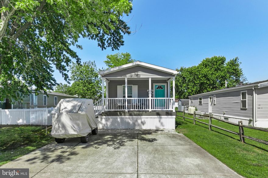Located in the waterfront community of Angola Beach and Estates, this lovely beach cottage is move in ready! The large front porch is so inviting, and perfect for relaxing and enjoying the summer breeze. Step through the front door and into a bright and spacious living room, that is open to a well appointed eat-in kitchen, with plenty of counter and cabinet space.  Down the hall you'll find the primary bedroom with a spacious en suite bathroom, a second bedroom, second full bathroom and the laundry area. The back door leads to a fully fenced back yard, with a wonderful barbecue area. And for all your storage needs,  there is a large shed, equipped with electric.
Only a short distance to Rehoboth Beach, restaurants and shopping, Angola Beach and Estates is a wonderful waterfront community on Burton Prong, connecting to the Rehoboth Bay. The community has multiple amenities, including a marina and boat ramp, fishing/crabbing pier, kayak storage, picnic areas, two pools, club house, basketball courts and tennis courts.  Being sold furnished with a few exclusions.
Call today to schedule a showing, and spend this summer in your new Delaware beach home!

Community application required. Buyer is subject to park approval, based on credit score, income verification, and criminal background check.