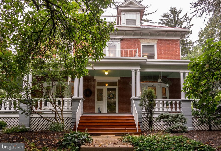 Introducing 512 South Potomac Street! An exquisite property made up of two parcels consisting of 1.44 acres. . The first lot of 0.97 acres consists of the residence which embodies elegance, spaciousness, and unrivaled privacy. This architectural gem was masterfully designed by renowned architect James Woltz in 1905, showcasing his exceptional craftsmanship and attention to detail. From the moment you arrive, the home's exterior captivates with its undeniable charm—a large, welcoming wraparound porch, a tranquil Japanese garden leading to a marble-edged pond, and meticulously landscaped areas adorned with a delightful variety of trees, shrubs, flowers, and even a flourishing vegetable garden. The crowning touch of endurance and durability is the attractive Vermont pink slate roof.
The second 0.47 acre parcel fronting on West 7th Street features a converted carriage house, now serving as a two-car garage, a rustic potting shed, and a pergola surrounded by a picturesque walkway, lawn, and flourishing gardens. 

Step beyond the captivating façade and discover a residence that has been lovingly maintained throughout the years. The house boasts six bedrooms, each offering generous space for comfortable living. Additionally, a large office/studio on the third floor could easily be converted into a seventh bedroom to suit your personal preferences. The interior appointments exude timeless elegance—a captivating brick fireplace that infuses warmth and character, magnificent stained glass windows, hardwood molding and woodwork that stand as a testament to the home's rich history and fine craftsmanship.


With the convenience of two stairways leading to the upper levels, accessibility is seamlessly integrated into the design. The home spans three finished levels, has 6 zone heating, and offers abundant living space for all your needs. The large basement is complete with ample storage, and has walkup steps to the outside. Remarkably, this home has had only two previous families in residence. Located in a tranquil and walkable neighborhood, this remarkable residence offers both seclusion and convenience, providing the perfect sanctuary to escape from the outside world. Whether you seek solace on the inviting porch, immerse yourself in the captivating gardens, or enjoy the timeless elegance within, this gracious, comfortable home offers a truly unparalleled living experience.