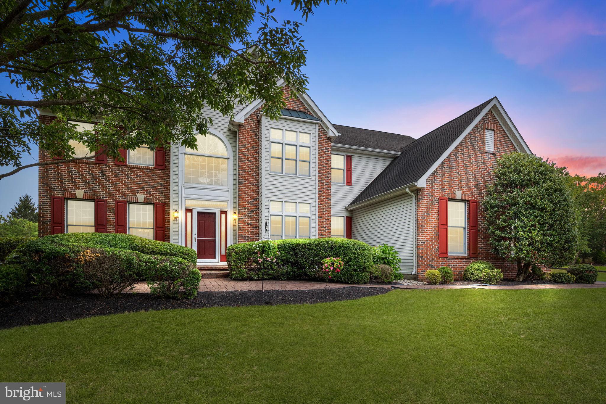 Perfectly situated on a quiet cul-de-sac in the small, private community of Newtown Meadows sits this executive Cedarbrook Model, on a .7 acre lot, available for the first time since construction in 2001. Some of the special features include a 2-story Dining Room, Main Level Office, rear staircase and skylights in the 2-story Family Room, 3 car Garage, central vacuum system, plus a finished Basement with Kitchenette, gas fireplace, 5th Bedroom and 3rd full Bathroom. Tremendous curb-appeal is provided with a brick front façade, keystone accents above the windows and a meandering paver walkway leading to the raised front entry with replaced door surrounded by lovely leaded glass accents. Enter the 2-story Foyer and take in the openness of the curved staircase, 2nd story sunburst-topped window, hardwood flooring and pleasing flow into the Living Room, Office and Kitchen. On the left, a formal Living Room with dual windows and replaced carpeting opens into the impressive 2-story Dining Room overlooked by an Upper Level balcony. A transom-topped window with views of the rolling rear lawn, hardwood flooring, chair railing and custom blinds graces this space. The bright Kitchen boasts an abundant amount of raised panel cabinetry topped with crown moldings, a tiled backsplash, countertops lined in warm granite and recessed LED lighting. A double stainless oven, natural gas cook-top, pantry closet and island with overhang for stool seating are also supplied. The bright Breakfast Room, with Andersen sliding glass door, opens to the Family Room. This massive room has triple transom-topped windows, a soaring ceiling with dual skylights, recessed LED lighting, replaced carpeting, a marble-faced natural gas-fueled fireplace and a luxurious rear staircase to the Upper Level. Double doors open to a sunny Office complete with hardwood flooring. Completing the Main Level is a Powder Room, plus a Laundry Room with access to the 3-car side entry Garage. Upstairs, the Master Bedroom Suite is exceptionally private, flaunting dual walk-in closets, a Sitting Room and sumptuous Bath. A cathedral ceiling soars over the oversized shower lined in tile with rainfall showerhead for everyday, while a double window with sunburst top is the perfect spot to sun gaze while relaxing in the sparkling white Jacuzzi tub on special evenings. Each of the 3 Secondary Bedrooms on the Upper Level have ample closet space, upgraded overhead lighting and multiple windows. The Hall Bathroom offers dual sinks, linen closet and a tub/shower combo lined with a neutral tile. With a combination of 2,770+/- square feet of finished space on these 2 levels, prepare to be amazed by the additional 1,200+/- square feet of finished Basement. With options as an Au Paire Suite or a space for a returning college graduate, the Lower Level has a modern Kitchen with frosted glass front cabinetry, custom concrete countertops, under-cabinet lighting, pendant lights atop a bar-style seating area, recessed lighting and designated space for a microwave and mini-fridge. Custom wall sconces on dimmers are strategically placed for movie nights and with a touch of a remote, a gas fireplace comes alive. A spacious Bedroom with full-size egress access, a beautifully completed full Bathroom and an Open Space perfect for a game table wraps up the fully permitted finished portion of the Basement, along with sub-panel for the electricity, done in 2008. A large unfinished area remains which houses the 2-zone natural gas HVAC, gas water heater, sump pump with battery back-up and tons of storage. The rear yard is huge and private, with a large deck, garden shed, and rear berm lined in trees. Within award-winning Council Rock North School District, this home is just minutes to all kinds of shopping and dining. Imagine living in the suburbs in an area still filled with farmland, yet with an easy commute to Philadelphia and NYC. This stunning home on Providence Court is ready for its next generation!