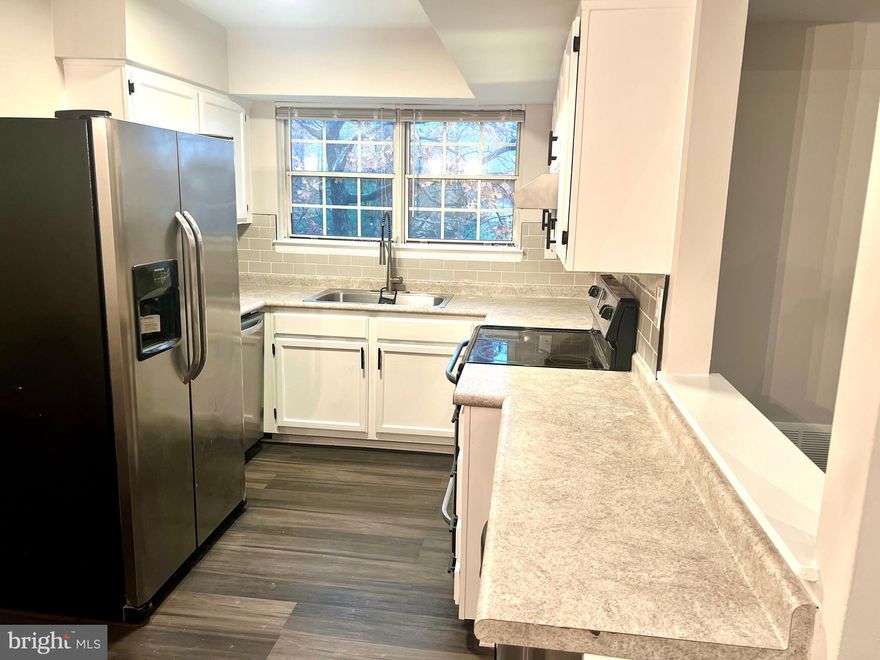 *** Professional pics 11/28/2023! Expected on the market 12/1/2023***Excited to share this amazing opportunity for you to own this updated condo competitively priced in a very convenient location! This modern two-bedroom, one-bathroom home offers a comfortable well-appointed living space, spanning across 855 square feet. The new stylish LVP flooring throughout, fresh paint and updated kitchen are just a few of the features you will love about this condo. 
Upon entering, you'll be greeted by an open family room with vaulted ceilings and a skylight that brightens up the space, creating a warm and inviting atmosphere throughout the day. To snuggle down for a movie your fireplace will offer not only warmth but the perfect ambiance. The kitchen boasts bright white cabinets with new black handles, new subway backsplash tiles along with sleek stainless-steel appliances, adding a modern updated feel to the space.  One of the condo's standout features is the lovely balcony that provides a pleasant lookout, allowing you to unwind and enjoy some fresh air after a long day. Being on the third floor, the balcony also offers a sense of privacy while still providing a beautiful view of the surrounding area. The primary bedroom is spacious and includes a large walk-in closet. The second bedroom can serve as an office or Zen space, as it is on the opposite side of the condo from the primary. This condo comes equipped with a convenient washer and dryer, ensuring you have the ease of doing laundry within the comfort of your own home. Location-wise, this condo has a prime spot, being conveniently close to shopping, transportation and more. You'll have easy access to shopping, dining, entertainment, and other amenities, making it a desirable and practical place to call home.