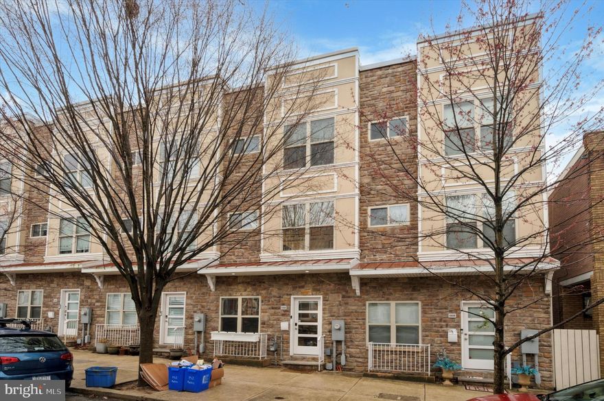 Just Listed- Modern Elegance in Manayunk. 152 Kalos Street is a spacious contemporary townhome. This stunning, light-filled contemporary townhouse in Manayunk, offers over 3,300 square feet of luxurious living space with three spacious bedrooms, 3.5 baths, and two private outdoor areas. Built in 2017, this home has two years remaining on the 10-year tax abatement, making it an exceptional opportunity.
Step inside to an open-concept main level, where the living and dining areas seamlessly flow into a stylish, modern kitchen. Floor-to-ceiling windows flood the space with natural light, complementing the warm grey Lauzon hardwood floors and LED lighting throughout. The living area is anchored by a 42" Napoleon gas fireplace, while the sleek kitchen boasts custom cabinetry, pure white quartz countertops, a glass backsplash, Samsung stainless steel appliances, and a spacious island—perfect for entertaining. Sliding glass doors lead to the rear patio, expanding your living space outdoors. A convenient half bath completes this level.
The second floor features two generously sized bedrooms, each with ample closet space and abundant natural light. This level also includes a full bath, a dedicated laundry/utility room with utility sink, and continued hardwood flooring throughout.
The third floor is dedicated to a private owner’s suite, featuring two large closets, a separate vanity area, and a luxurious spa-inspired bath with a soaking tub, oversized shower, double sinks, and a private toilet area.
The fourth level is an entertainer’s dream—an expansive full-length roof deck equipped recently with a 3-year warranty) with two distinct areas for relaxing, hosting guests, or taking in breathtaking sunsets. The deck also includes a convenient outdoor water spigot. The fully finished lower level offers an additional 720 square feet of versatile living space, a full bath, a utility room, and direct access to the built-in one-car garage, which includes an additional outdoor water spigot. An exterior parking space adds to the home’s convenience. This home is equipped with two-zone HVAC, managed by Lennox iComfort smart thermostat with wireless control through an app. Also comes with a Culligan Smart High Efficiency Water Softener which can be controlled & monitored through an app. Located just 0.2 miles from the SEPTA Wissahickon Train Station—a quick three-minute walk—this home provides effortless access to Center City, the Schuylkill Expressway, Kelly Drive, City Ave, and Main Street in Manayunk. One block from La Noce Park with a playground for kids and grassy area for dogs. 10-minute walk to Cook-Wissahickon school & Wissahickon Valley Park. Within 2 miles of five major grocery stores, Target, Panera, Chipotle, Chick-Fil-A, and more. Don’t miss this rare opportunity to own a modern, move-in-ready townhouse in one of Philadelphia’s most desirable locations!