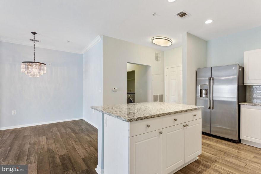 Beautiful, spacious two bedroom unit, recently upgraded for about a year with elegant quartz countertops, large kitchen island, new stainless steel appliances, crown molding, ceiling fans, new flooring, full size washer and dryer, a cozy balcony, and one-assigned garage parking spot.  Sold as is in great condition. Conveniently located off 66, near Fairoak Mall, Fairfax Corner, Wegmans, Costco and Whole Foods and lots of restaurants and stores. About 3-5 miles to GMU, Centreville, 29 and Vienna metro and 10 miles to the airport.  Community amenties include a business center, fitness center, outdoor pool, and club house.  Low monthly HOA fee. A rare find in this zip code! Come see now.