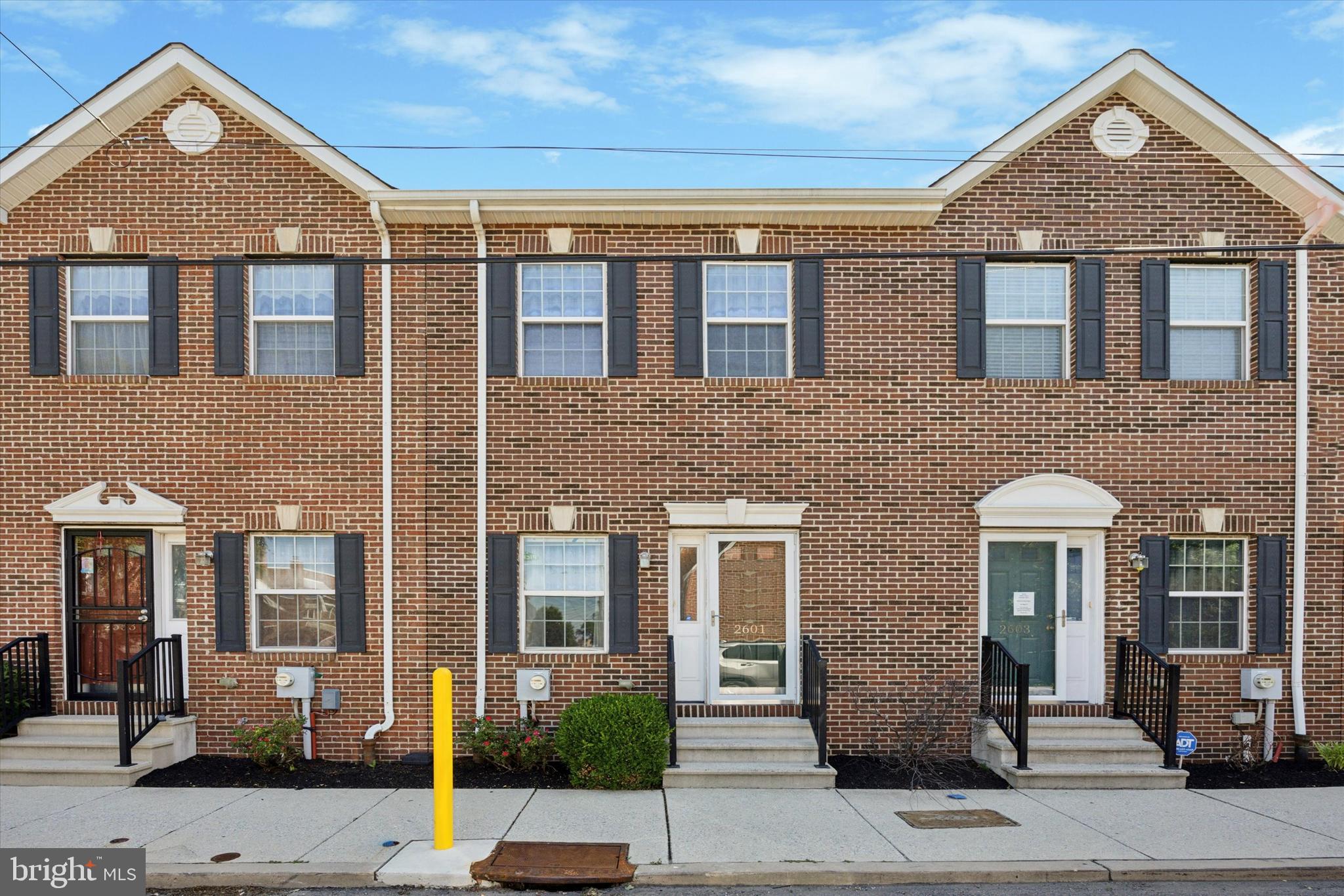 Welcome to this beautifully maintained brick-front townhome in the heart of historic Port Richmond. This 3-bedroom, 2.5-bath home offers nearly 1,500 square feet of living space and an unbeatable location—just steps from Target, ShopRite, Home Depot, public transportation, and minutes to Center City and I-95.
Inside, you'll find an open-concept main level with gleaming hardwood floors throughout. The spacious living and dining areas are filled with natural light and feature block-out remote-controlled blinds for privacy. The large kitchen is a standout, featuring stainless steel appliances, cherry wood cabinetry, upgraded countertops, subway tile backsplash, a pantry, and a bar with seating for two. A French door off the kitchen leads to a private patio and two dedicated parking spaces—ideal for easy grocery unloading.
A stylish half bath and coat closet complete the main level. Upstairs, the primary suite includes two large closets and an ensuite bath with double vanity, porcelain tile, polished gold fixtures, a rain shower, and a smart anti-fog mirror with customizable lighting. Two additional sunlit bedrooms share a modern hall bath with a tub/shower combo and hexagonal tile flooring. A newer stacked washer and dryer are conveniently located on this level. The finished basement, with high ceilings and a full-size window, offers flexible space for a home office, gym, playroom, or additional living area. It also includes ample storage. Heating and cooling are controlled by an Ecobee Wi-Fi smart thermostat. Move-in ready with thoughtful upgrades throughout, this home is a true gem in one of Philly’s most convenient neighborhoods. Don’t miss your chance—schedule your showing today!