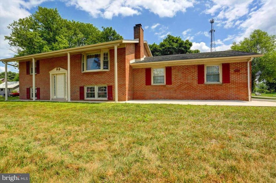 SEE PROPERTY VIDEO TOUR!!! Located just a minute from Interstate 81 (exit 23), you’ll find this 3-bedroom, 2 full bath, all brick, classic bi-level on 2/3 of an acre boasting almost 2,000 square feet of living space!  Entering the front door, you’ll be greeted by the split staircase.  Ascending to the upper level, you’ll find a large inviting living room with a bay window and brick (gas) fireplace.  From the living room is the combination kitchen/dining area featuring a pantry closet, stained wood wainscoting throughout, stainless appliances, double bowl sink, walk-out access to the garage and French doors leading to the rear deck.  Off the main hallway, you’ll find 2 main level bedrooms, one of which features a stained hardwood floor.  A full bath completes the main level.  Descending the stairs to the lower level, you’ll find a fully finished basement area including another bedroom with a beautiful, stained tongue and groove ceiling, large family room area, another full bathroom, a laundry/storage area, a utility room, and an additional walk-out door to the garage area.  The garage offers parking for 2 vehicles as well as ample room for a workshop area.  The driveway allows for 2 additional cars and the gravel parking area behind allows for 2 more, bringing the total to 6.  Combine all of this with newer vinyl windows, beautiful stained woodwork throughout, an AC compressor that was just replaced, a larger than typical yard, and effortless access to interstate 81 and this may be the home for which you’ve been looking!