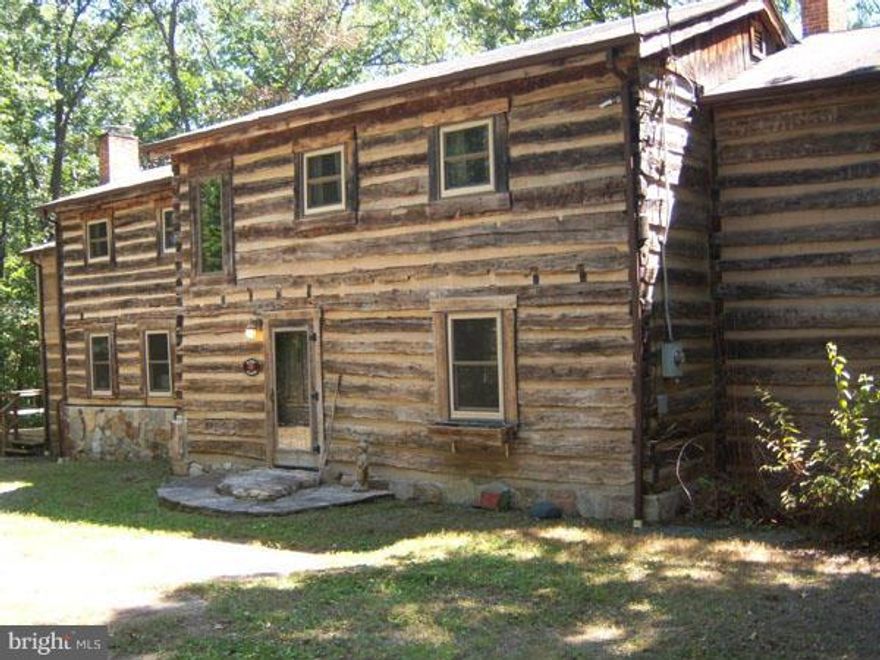 Step Back in Time, 1850's Era Log Home expertly reconstructed on this beautiful lot with views of Sleepy Creek Mountain. Modern central heat and air along with new roof, windows, custom cabinetry, cast stone counter tops blending the past with the present. Only 90 minutes from DC and Baltimore allows you to enjoy the Town of Bath with all the spas and art. Call Today!