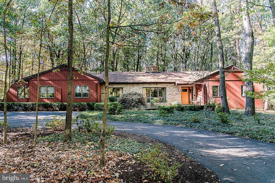 Gorgeous Rancher situated privately on over 5.5 acres. This home was Custom designed with single-level living in mind. Extensive renovations completed in Spring of 2021 include  fully remodeled kitchen with beautiful Quartz countertops and all brand new SS appliances. All bathrooms have been upgraded. New carpet throughout. Home features Brazilian cherry hardwood floors with gas and wood burning fireplace, screened in porch and patio. New Carrier HVAC installed in 2021.