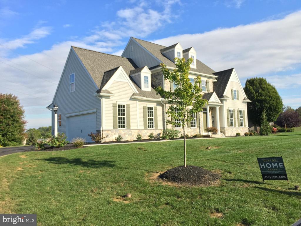 THIS HOME IS READY NOW! Classic architecture/authentic stone! Over 2500 SF (plus LL) 4 beds/2.5 baths. Modern master suite w/vaulted ceiling, plus dazzling bath w/tile - both around luxury soaking tub & full shower. AMAZING solid kitchen w/soft close drawers, granite tops/natural stone back splash & spacious island w/seating.