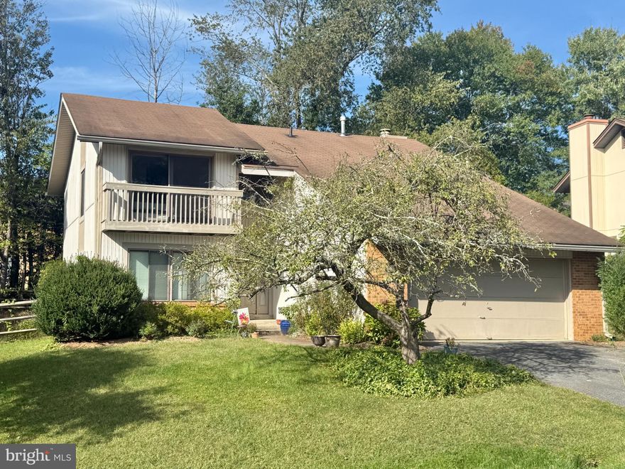 Nestled in the charming community of The Points, this delightful contemporary home offers a perfect blend of comfort and functionality. With 2,709 square feet of thoughtfully designed living space, this residence features five spacious bedrooms and two and a half bathrooms, making it an ideal retreat for those seeking both room to grow and cozy corners to unwind. Step inside to discover a warm and inviting atmosphere, highlighted by beautiful hardwood flooring that flows throughout the main living areas. The formal dining room sets the stage for memorable gatherings, while the eat-in kitchen is equipped with modern appliances including a built-in microwave, dishwasher, new stainless steel refrigerator and electric oven/range. The updated kitchen with maple cabinets, granite countertops, and stainless steel appliances has a  layout that encourages both casual meals and entertaining, ensuring that every occasion feels special. The heart of the home is the cozy living area, complete with a wood-burning fireplace that adds a touch of warmth and charm. Imagine curling up with a good book or enjoying a movie night with loved ones in this inviting space. The fully finished basement offers additional versatility, perfect for a playroom, home office, or entertainment area. Outside, the community amenities are truly exceptional. Residents of The Points enjoy access to a sparkling outdoor pool, basketball courts, tennis courts, and scenic jog/walk paths that wind around a picturesque lake. The nearby tot lots and playgrounds provide a safe and fun environment for outdoor play, making it easy to embrace an active lifestyle. With well-maintained public services and a welcoming atmosphere, you'll find everything you need within reach. This home also features a two-car attached garage, ensuring convenience and ample storage. The outdoor patio invites you to enjoy warm evenings under the stars, perfect for barbecues or simply relaxing with a cup of coffee. With its blend of modern amenities, community spirit, and a prime location, this home in The Points is more than just a place to live; it's a place to thrive. Experience the comfort and joy of living in a community that truly feels like home.