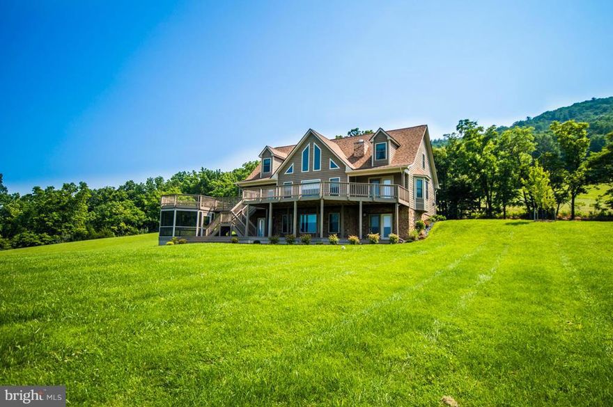 Beautiful custom built chalet on 4.4 acres.  Features a view from every room! Enjoy quiet, privacy in this immaculate home. Gourmet kitchen, gas stove, HW floors. Full finished basement w/ gorgeous tile, pool table conveys, bedroom, exercise, full bath. Open floor plan, Stone FP in LR. Exterior has extensive decking, gazebo, new landscaping.Upper loft w/BR & Walk-ins.Perfect full time or 2nd home