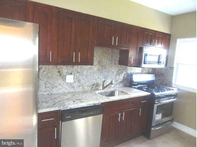 REDUCED Renovated three bedroom one and half bath house in northwest Baltimore. This house has a new kitchen, stainless steel stove, microwave, dishwasher, and refrigerator. Partially finished basement, refinished hardwood floors in the living and dining rooms, new carpet in all three bedrooms. New full bathroom. The seller will assist with closing. Show and Sell.