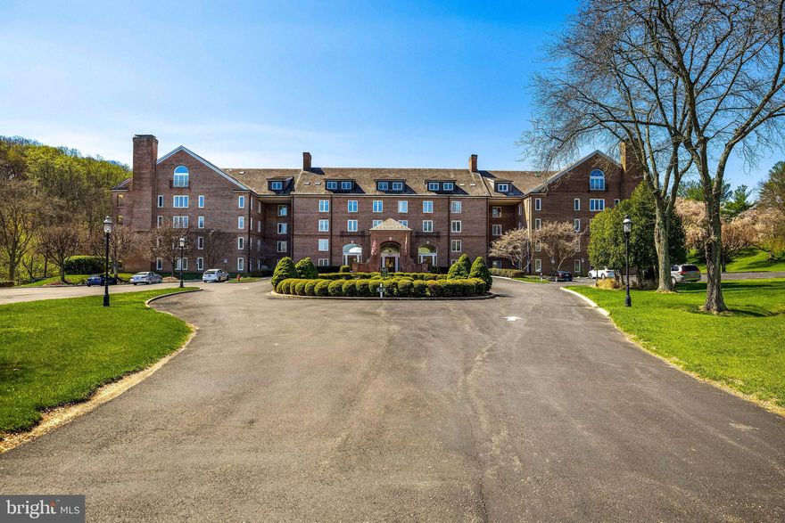 Welcome to The Risteau—an iconic, stately brick residence approached by a picturesque, tree-lined drive, where a sparkling fountain rests gently within a tranquil pond, all embraced by lush woodland surroundings. While the building itself is admired for its timeless elegance, Unit 307 offers a truly exceptional distinction: an extraordinary, unobstructed panorama of the surrounding forest.
From this elevated vantage point, each season unfolds like a living work of art. Winter brings a serene, snow-draped stillness; spring arrives in a vibrant chorus of migratory birds and the gentle murmur of a nearby creek; summer and autumn paint the landscape in rich, ever-changing hues. Remarkably, every room within the residence is oriented to capture this captivating natural backdrop.
The interior has been thoughtfully reimagined to enhance both flow and light, with a refined open-concept layout that creates a spacious, airy living environment—entirely free of visual interruption to the scenery beyond. Designed for both comfort and sophistication, the residence features in-unit laundry and a generously proportioned primary suite, complete with a beautifully customized walk-in closet and an elegant en-suite bath offering a step-in shower and dual vanities. Additional conveniences include a deeded storage unit and two dedicated parking spaces—one in the garage and one surface space.
Residents of The Risteau enjoy a full-service lifestyle with an impressive array of amenities, including a dedicated on-site manager, concierge services, assistance with groceries, in-house maintenance, multiple elevators, a stunning outdoor pool, and tennis courts, multiple meeting/game rooms—all curated to provide effortless, elevated living. A rare offering where natural beauty and refined living converge—featuring, without question, one of the most breathtaking views in the building.