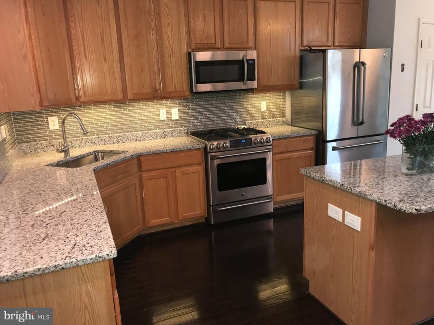 Renovated Kitchen!! THIS Stunning 3Bed/3Ba TH in River Hill, Clarksville Elem and Middle School District! With 2 oversized Bed with 3rd  Bed on LL and/or  Huge Family Rm! All with full baths Enjoy eco-friendly/thoughtful upgrades throughout; Gourmet Kitchen with Island and Granite, w/SS Appl & HARDWOODS FLOORS ON MAIN LEVEL!! NEW CARPET ON TOP AND LOWER LEVEL!!! Master Bed Retreat with jacuzzi tub, 2 walk-in closets, vaulted ceiling and spacious upper and lower Deck.  Move In Now!