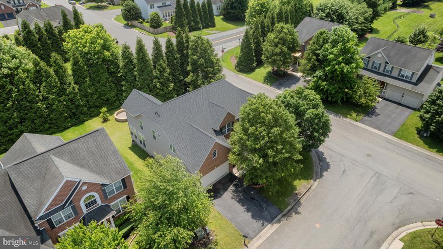 PENDING RELEASE OF BUYER ( Financing of buyer’s loan and situation) — THEIR LOSE, YOUR GRANT —  Grand, Beautiful Brick Front Home with plenty of room for everyone! Main Level features an inviting 2 Story Foyer with designated Living Room, Formal Dinning Room, Private Office or Main Level Bedroom, Open Family Room with Fireplace and Mantle, Entertainers Kitchen with Panty, Island, abundance of cabinets and countertop space and table space, breakfast room, 2 story Sunroom, half bath, and access to your 2 car garage and deck and patios out back. Upper Level offers a dream Primary Suite with Siting Room, 2 Large Walk in closets, and a private spa like bathroom to retreat to with double sinks, soaking tub, walk in shower and private toilet room. Also on this level there are 3 additional Bedrooms, a Full Bathroom with double sinks, and Laundry Room.  In addition the Lower walk out basement is finished a ton of space! Plus  a movie theater room, gym room, rough ins for an additional Full Bathroom, utilities and storage. Highlights are New Roof, HVAC, Fresh Paint, Carpet, Central Vacuum, Intercom, Corner Lot... The list goes on!  Great Location, and a desirable established Neighborhood.