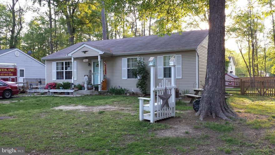 NICE 3 BEDROOM / 2 FULL BATH RAMBLER IN WATER ORIENTED COMMUNITY!  THIS HOME SITS ON A CORNER LOT AND CONSIST OF 6 LOTS!  FENCED BACKYARD WITH STORAGE SHED AND DECK!  WIDE DRIVEWAY CONVENIENT FOR PARKING MULTIPLE CARS.     CARPET ABOUT 2 YEARS OLD.....HARDWOOD...AND SO MUCH MORE!  SELLER IS OFFERING A HOME WARRANTY!