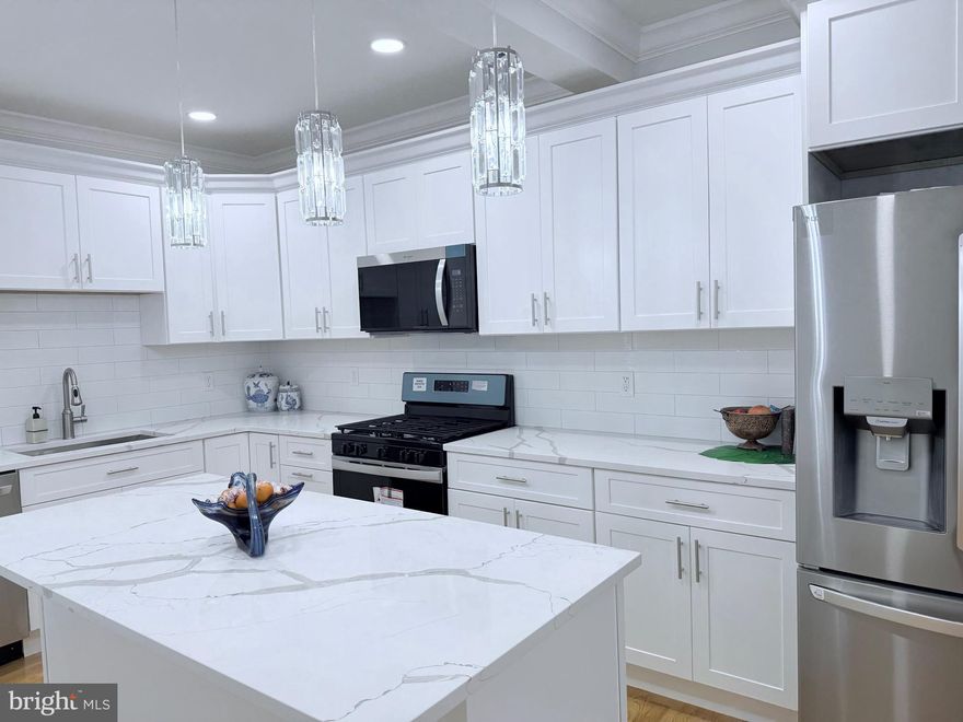 Welcome to 2011 Morris Street , where city living feels grounded, intentional, and refreshingly attainable. On a wide, quiet block in the heart of South Philadelphia, this thoughtfully renovated 4-bedroom, 3-bath home offers more than 1,600 square feet of modern comfort. Designed for real life, where comfort meets connection and everyday moments matter: move-in ready, beautifully finished, and still under $500K.

As you step inside, sunlight spills across rich hardwood floors, highlighting crown molding and an open main level that balances everyday ease with effortless entertaining. This is where mornings start calmly and evenings unfold naturally—whether you’re cooking, hosting, or simply unwinding. The kitchen anchors the space with quartz countertops, classic shaker cabinetry, stainless steel appliances, a generous center island, and timeless tile—equal parts functional and inviting.

Downstairs, the finished basement with a full bath opens up endless possibilities. Guest suite. Home office. Gym. Media room. Play space. The flexibility here means the home can grow and shift with you—without compromise.

Behind the walls, the peace of mind matters just as much as the design. Brand-new systems, plumbing, and electricals, paired with energy-efficient central air, make this a smart, low-stress investment in your future—one that lets you focus on living, not fixing.

Out back, a private rear yard becomes your personal retreat. Morning coffee, summer dinners, container gardening, or a quiet moment at the end of the day—it’s outdoor space that truly gets used.

For first-time buyers, this home is especially compelling. With potential access to Philadelphia homebuyer grants, closing cost assistance, and incentive programs, ownership here may be more achievable than you expect. Why rent when you can own?

And then there’s the lifestyle. A highly walkable setting. Local cafés and neighborhood favorites close by. A bus stop right on the corner. Quick access to Center City, Graduate Hospital, and East Passyunk. This is city living with rhythm and charm—connected, convenient, and comfortable.

This is not just a home—it’s a smart investment, a fresh start, and a lifestyle you’ll love coming home to.