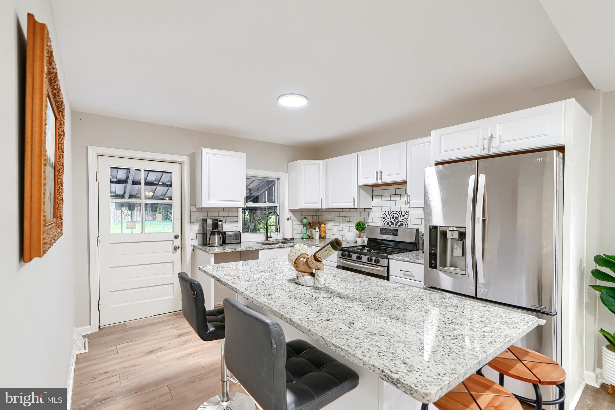 Welcome to 8505 Oakleigh Rd, a 3bd/2ba updated rancher in Baltimore County's Parkville neighborhood. Featuring an open floor plan, a main level bedroom and bathroom, updates throughout and a massive yard, this home is sure to impress! The enclosed sunroom/porch is perfect for entertaining on summer nights. There's plenty of space to entertain in the open and spacious living room, which opens nicely to the dining area and kitchen. The kitchen is well-equipped and includes stainless steel appliances, granite countertops, large cabinets and a spacious island. The two main level bedrooms are spacious and sun drenched, plus there is a main level full bathroom for added convenience. The lower level is finsihed and offers a third bedroom space, additional full bathroom and plenty of storage. The rear yard offers plenty of room for hobbies or play! You won't find a better deal for such a well-appointed home!