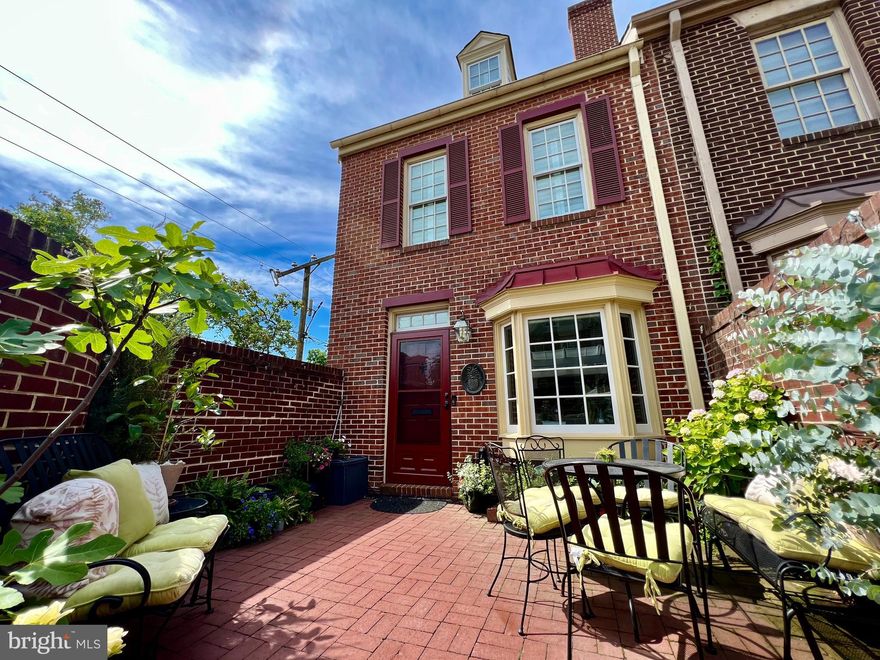 Welcome to the charming Shad Row Townhome Community. This lovely 4 story end unit townhome of 1350 square feet of finished living space has 2 bedrooms, 2 bathrooms, a basement perfect for working from home or for use as a den or guest bedroom. Gleaming hardwoods and fresh paint throughout. Wood burning fireplace in living room open to large brick walled courtyard perfect for entertaining. Renovated kitchen with quartz countertops, copper sink with new faucets, brick backsplash, stainless steel appliances with new dishwasher. New faucets, fixtures and hardware throughout. Energy efficient windows, heat pump powered by Ecobee and Ring doorbell. This home comes with an assigned parking space in the covered garage where there is a bike storage room. The Shad Row community includes new pergolas and gazebo. Shad Row has an incredible Walk Score of 94. Trader Joe's and a Capital Bikeshare station are just across the street. Harris Teeter is two blocks away and you are three blocks from the Oak Steakhouse, St. Elmo's coffee, and many more shops and restaurants. King Street and the waterfront are only four blocks away. The location provides easy access to the GW Parkway and a short drive to Reagan National Airport. The Braddock Road metro is an easy 0.6 mile walk away. Seller provided Home Warranty. Call today for your private showing.