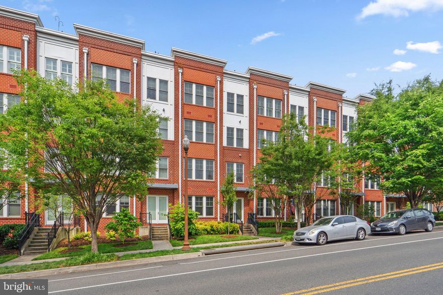 Better than new 2-Bedroom plus Den duplex with 2-car garage parking and walking distance to 2 Metro Stations.  Light-filled open floor plan, large windows, wide living space.  Kitchen has breakfast bar, professional grade stainless appliances, granite counters, amazing storage.  Master suite includes double walk-in closets, spa-like bath with separate tub & shower.  ELFA closets.  Must see.