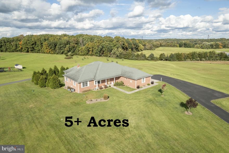 READY FOR  YOU!! , LOOKING FOR THE PERFECT HOUSE? LOOK NO MORE! Welcome to this stunning 3220+sqft ranch home, perfectly situated on over 5 acres of natural beauty. This home offers 360 degree panoramic views of mountains, fields and trees. Spacious family room with pellet stove. Large Upgraded kitchen with tons of cabinet space, cabinets with pull out drawers and soft close, pantry area, large island, granite counters, eat in bar area plus table space. Love to entertain? Formal dining room for family gatherings or enjoy the outdoor space on huge covered deck.  4 bedrooms, 2.5 baths. Primary bedroom with large bathroom with his/her sinks, soaking tub and shower plus huge walk in closet for all your clothes and shoes. Home is handicap accessible with wide doors. Walk in mud room/laundry room. High speed internet is Fios, Dish used for cable tv. Unfinished basement with partially finished 3rd full bathroom and wood stove hook up plus additional 3rd garage space. Endless possibilities for the unfinished walk out basement. 3 car garage spaces. No HOA! Generator hook up.