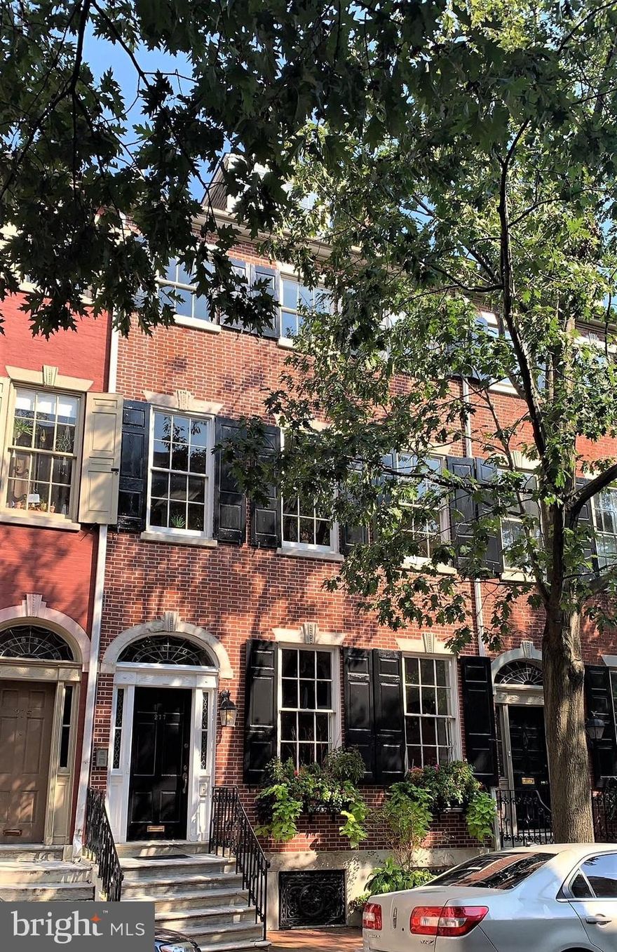 High-end 1 bedroom apartment in fabulous Society Hill building. This first-floor front unit has everything! Tons of sunlight flood this unit from the 2 large windows overlooking beautiful 4th and Spruce. Exquisitely finished hardwood floors are throughout. Custom window shutters, designer light fixtures, crown molding, original marble mantels in the living room, and bedroom with 2 closets (one cedar) and great window with nice light and privacy. Full bathtub and marble tile surround. This unit has it's own private washer/dryer right outside the unit door.