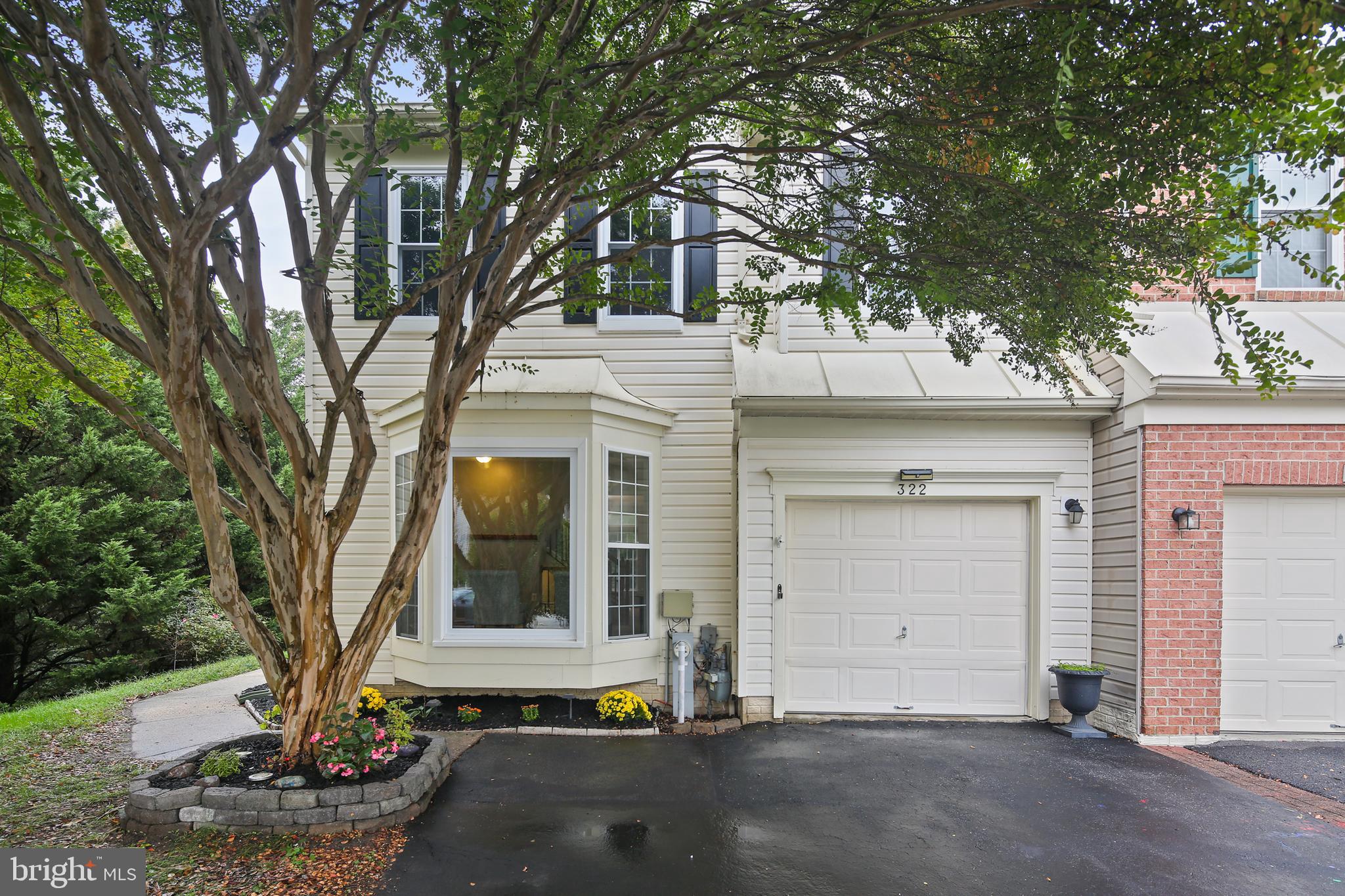 Welcome to 322 Timberbrook Ct, Odenton, MD! This End-Unit, three-level townhome offers the perfect blend of space, comfort, and convenience. The main level showcases beautiful hardwood floors that flow seamlessly through the open living and dining areas making it ideal for entertaining or cozy nights in. The large updated Kitchen is a chef's dream. This area opens up to the massive deck space overlooking the yard. Upstairs, you’ll find 3 large bedrooms with plenty of natural light and ample closet space. The finished lower level features a walk-out to the backyard, providing a versatile area for a family room, home office, or gym. Step outside to enjoy an expansive yard space rarely found in townhomes, complete with massive paver patio, perfect for gardening, outdoor dining, or play. As an end unit, you’ll appreciate the added privacy and extra windows that make every room feel bright and inviting. Conveniently located near major commuter routes, shopping, dining, and Fort Meade, this home delivers both lifestyle and location. Don’t miss your chance to own this spacious and well-appointed townhome in sought-after Odenton!