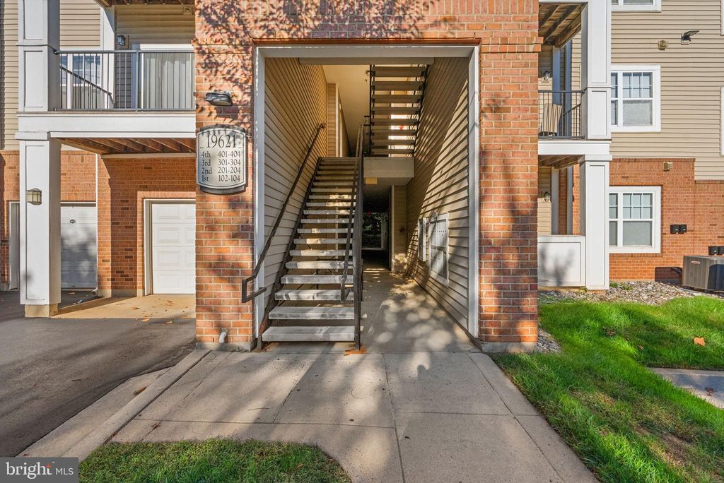 Photo of 19621 Galway Bay Circle #302, GERMANTOWN, MD 20874 (MLS # MDMC2204328)