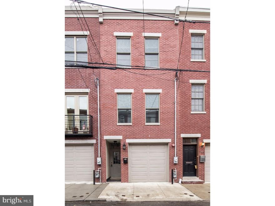 Stunning 5 yr old New Construction with GARAGE PARKING.  The 2300 Sq ft home features 3 bedrooms/3   baths. 1st floor: Custom Kitchen w/breakfast bar, stainless steel appliances, quartz countertops, tiled backsplash and access to the two tiered patio/garden, powder room and steps lead to the spacious living room.  2nd Floor: Master bedroom w/ample closet space and an ensuite full bath w/dual vanity, beautiful tiled steam shower w/glass enclosure and Jacuzzi tub and separate laundry room.  3rd floor: 2 addititional bedrooms and hall bath, rear bedroom has access to private deck w/spiral staircase that leads to rooftop deck w/awesome skyline views.  Walk out finished basement w/porcelain tile and radiant heat floors with thermostat control and an additional full bath. Highend finished throughout....Hardwood floors, dual hvac system, alarm system, Juliet balcony's, crown moldings, high ceilings and recessed lighting.  Tax Abatement good throgh December 2022.  Convenient Location....Close to great restaurants, museums, public transportion and all that Center City has to offer.  Show's Beautifully!