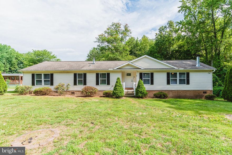 WOW! This 2000+ sqft home sits quietly on a little over an acre! As you enter the home you step into a grand foyer with closet. To the left there is a hallway leading to the laundry room, a full hall bath, 3 generously sized bedrooms and a large primary bedroom with its own full bath! There is a huge open concept kitchen with island, brand new SS appliances, butlers pantry, a dining area and a huge living room! Located off the kitchen are rear sliders that take you down brand new steps leading to your backyard! One level living at its finest! Brand new paint & carpet! Schedule your showing today!
