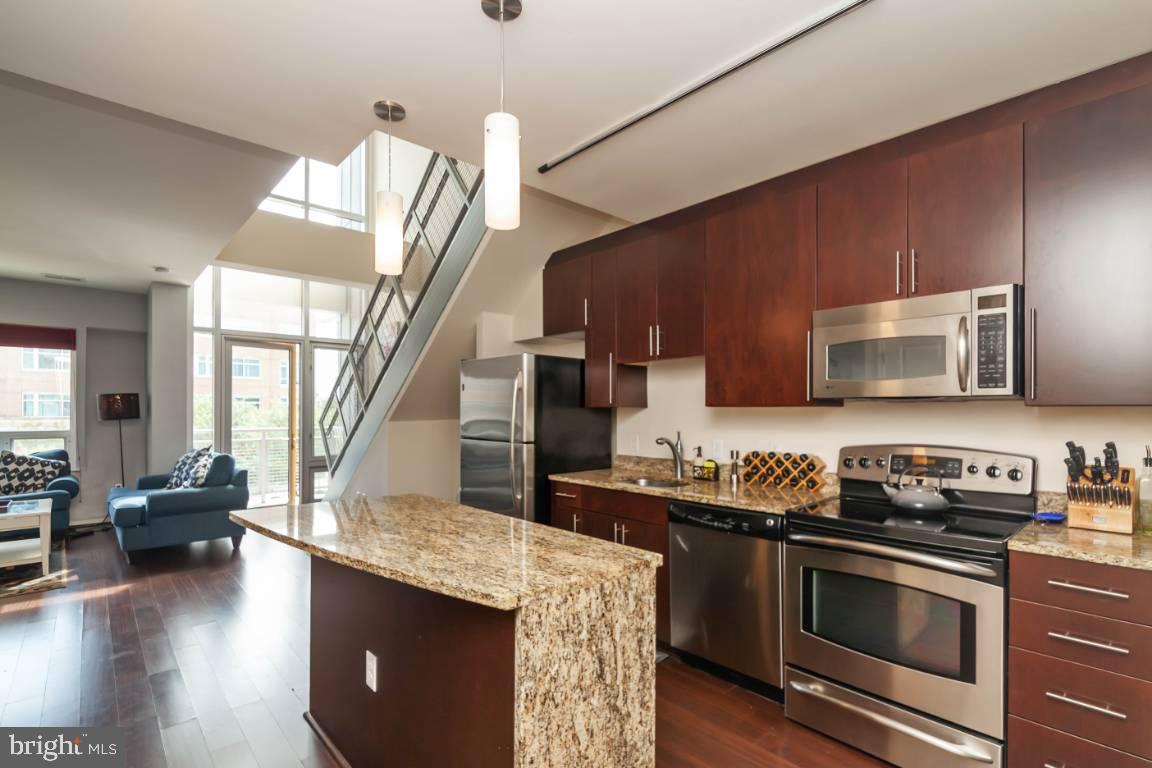 Stunning two level condo with open floor plan! Gourmet kitchen with granite counters, SS appliances, and island. Large master suite and bonus loft space and in-unit laundry. Plenty of amenities including club room, fitness center, courtyard, and garage and building is pet-friendly and includes a secure entrance. Part of the University Town Center with nearby shopping/restaurants/bars/mall & movie theater all within short walking distance. 10 minute walk to the Metro Station with another 20 minute ride into DC. 1 assigned parking space is included in the parking garage.