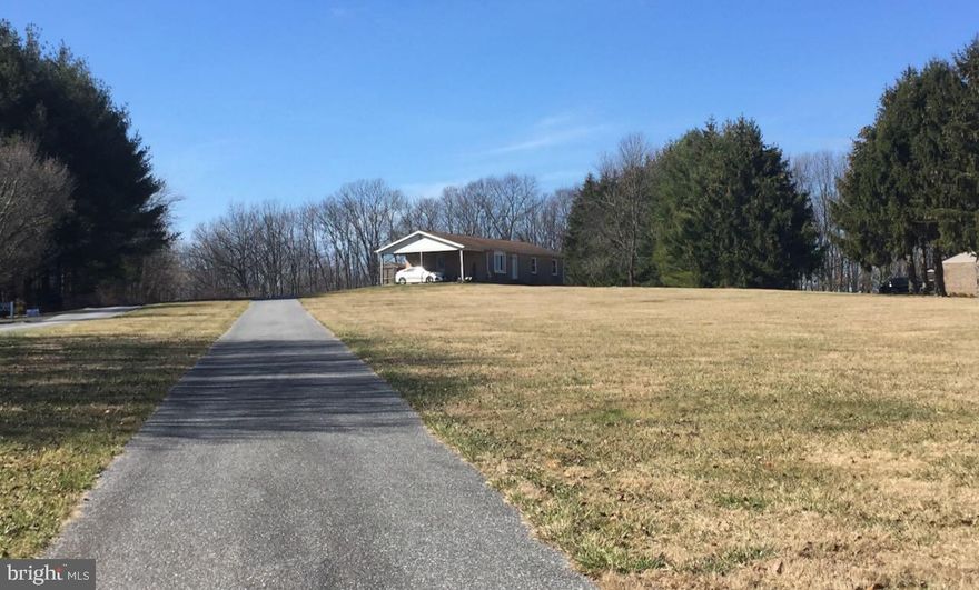 Have a look at this charming spot between Winfield and Westminster. This place isn't just another house on the block; it's a cozy retreat spread over a generous 2.9 acres, giving you space and privacy that's hard to find these days.

The recently renovated main level is full of neutral tones and polished hardwood. Light is in no short supply, with a contrasting ability to darken any room with plantation shutters. It’s all been maintained by someone who really cared about the place, and it shows

The outside is just as great as the inside. There's a new driveway that was put in recently – it's all yours, leading right up to the carport and massive parking pad. If you're into cars or crafting, the large workshop/garage is a dream. It's spacious, detached, and it's got enough room to serve as any home project, zero-turn mower, or more vehicles.

The two full bathrooms were remodeled last year, with high end vanities and finishes. 

The kitchen has locally sourced soapstone countertops. Hot pots, icy pitchers? No problem. They can handle it all without a single complaint. Note: the retro appliances are being swapped out for traditional white ones that'll give the kitchen a clean, modern look.

Imagine having your morning coffee out on the deck, or hosting weekend BBQs with all that yard space – it's got the perfect setup for both.

So, that’s the grand tour. It’s a place with the space to be yourself and room to grow. And it’s just waiting for someone new to call it home. Could that be you?

NOTE: No appointments without confirmation. The home is owner occupied and needs to be coordinated in advance. Do not drive up to the house without an appointment, or disturb the owner.