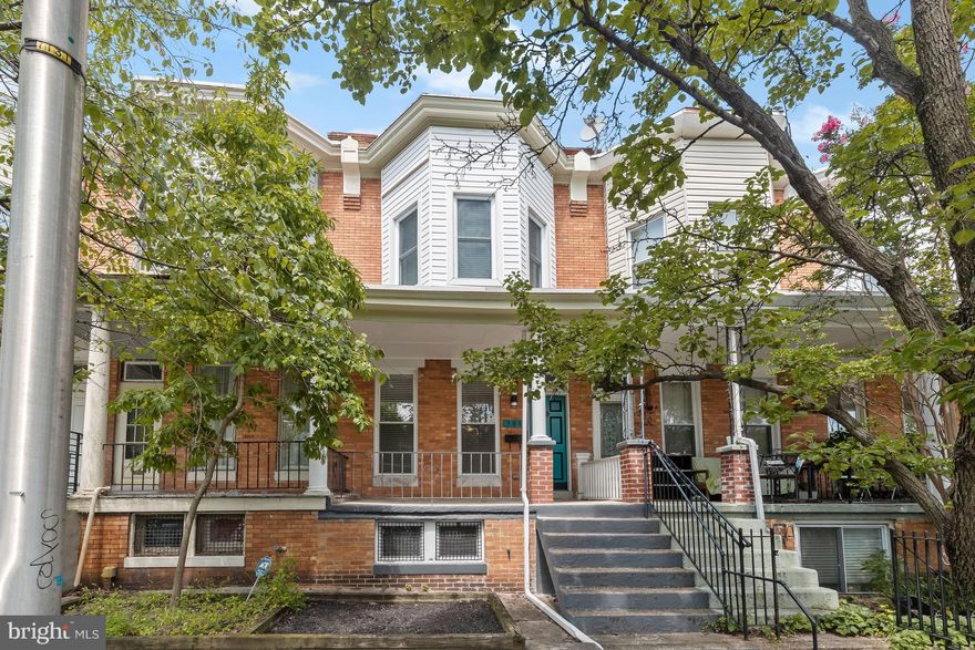 ***Deadline for all BEST & FINAL Offers due Sunday 10/15 at 8:00pm***Welcome to this spectacular three-bedroom, two-bathroom rowhome nestled within the charming Hardwood neighborhood. Bathed in sunlight, this residence boasts not only exquisite updates but also a delightful rooftop deck. As you arrive, the covered front porch extends a warm welcome, providing an ideal space to unwind. Upon entering, the main level greets you with an open-concept layout that seamlessly connects the various spaces. The expansive living room, adorned with engineered hardwood floors and tasteful dentil crown molding, exudes sophistication and comfort. This area serves as a hub for relaxation and gathering. The eat-in kitchen was thoughtfully renovated three years ago and is equipped with slate stainless steel appliances, a stylish tile backsplash, sleek modern concrete countertops and a breakfast bar with dimmable pendant lighting. The kitchen conveniently opens to the fully-fenced rear patio, perfect for outdoor dining and leisure. Transitioning to the upper level, a stylish staircase with iron balusters guides you. Here, you will find a sun-drenched skylight and the continuation of hardwood floors. The primary bedroom, boasting a bright bay window, creates a serene retreat. Moving along the hallway is a full bathroom and the second bedroom. The third bedroom offers access to a rear deck. A spiral staircase invites you to explore the rooftop deck with panoramic city views and an ambiance of privacy. Venturing to the lower level, the fully-finished basement presents an expansive family room with plush carpeting and an abundant space for leisure and activities. This level also houses a laundry area and the convenience of a second full bathroom. Enjoy this excellent location close to the best that Baltimore has to offer with a wide variety of shopping, dining and entertainment options closeby.