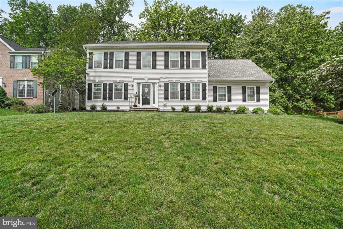 Immaculate colonial in coveted Harvest Ridge neighborhood has been impeccably maintained and is ready for a new owner. As you approach, you are struck by the incredible curb appeal and views of woods from the front which is exceptionally unique. Enter to a beautiful two-story foyer, with newly refinished hardwood floors throughout the main level and light filled gathering places. A neutral gray color palette is warm and inviting throughout. The heart of the main level is a beautiful family room, flanked by a gas fireplace, with a great flow into the kitchen. The kitchen has been updated with granite countertops and stainless steel, Samsung Appliances. A cozy breakfast nook leads seamlessly to your rear deck. The rear deck overlooks a beautiful tree canopy creating a "wood-like" feel. The main level also features a formal dining room great for entertaining and a cozy living room or sitting room, and an updated powder room. Upstairs features four bedrooms including a spacious primary suite. The primary suite is exceptional with a renovated en-suite bath (2017) featuring double vanity and detailed tile work. The primary suite closet is a massive walk-in, running the length of the garage. Three additional bedrooms upstairs with new carpeting are supported by a fully remodeled hall bath. All the bedrooms are generously proportioned. The lower level is unfinished and ready for finishing if desired. There is a full bath "rough-in" and walk up stairs to the rear yard. Additional features include a two-car garage with insulated garage door (2017), newer Vytex windows and doors (2016), hot water heater (2019), and recently sealed driveway. This home is stunning and a must see. Ease of access to Route 27 and I-70, Rattlewood Golf Course and all Mt. Airy has to offer. Welcome home!
