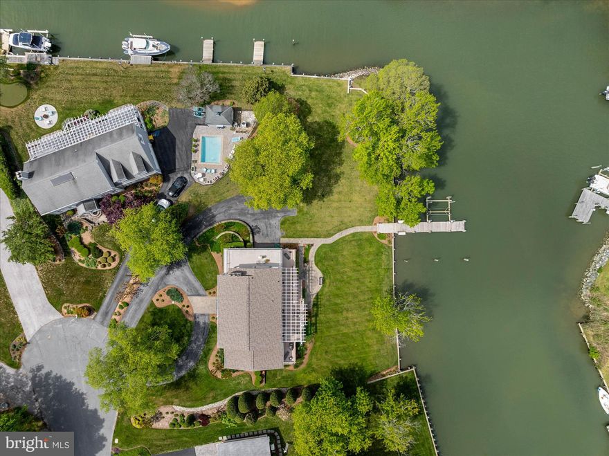 On the market for the first time in over 33 years, this exceptional waterfront home on protected Watergate Harbor is a rare opportunity to own a piece of Annapolis's most coveted water lifestyle. With 200+ feet of private waterfront and seconds-away access to the South River, this is the property you've been waiting for.

Step outside to your private 41' pier —  with 2 slips, one with an 15,000lb boat lift and floating dock — and enjoy manicured lawns that sweep gently to the water's edge. Whether you're launching a boat at sunrise or hosting summer gatherings on the grass, the outdoor experience here is simply unmatched.

Inside, over 3,400 finished square feet above grade offers a warm, gracious floor plan designed for both everyday living and effortless entertaining. The heart of the home is a spacious, updated kitchen and family room with high ceilings, and French doors that open directly to the waterside decks. The formal dining and living rooms add classic elegance, while the show-stopping sun room — lined with walls of windows overlooking the harbor and South River — is a space unlike any other, anchored by a pass-through fireplace shared with the living room.

Upstairs, three bedrooms and two full baths await. The primary suite is a true retreat, featuring vaulted ceilings, a spa-inspired bath, a walk-in closet, and a private balcony perfectly positioned to catch the South River's legendary sunsets. A convenient upper-level laundry room rounds out the second floor.

The lower level offers an abundance of unfinished storage space plus a full bath with shower — ideal for rinsing off after a day on the water. An oversized two-car side-load garage completes the picture.

The exterior of house was professionally painted within the last year; and the waterside deck is also new. Lovely landscaping complements the home. 

Beyond your own backyard, the Watergate community enriches daily life with a marina, pavilion, small beach, tot lot, basketball court, and a full calendar of neighborhood social events throughout the year.

NO CONTINGENT CONTRACTS PLEASE